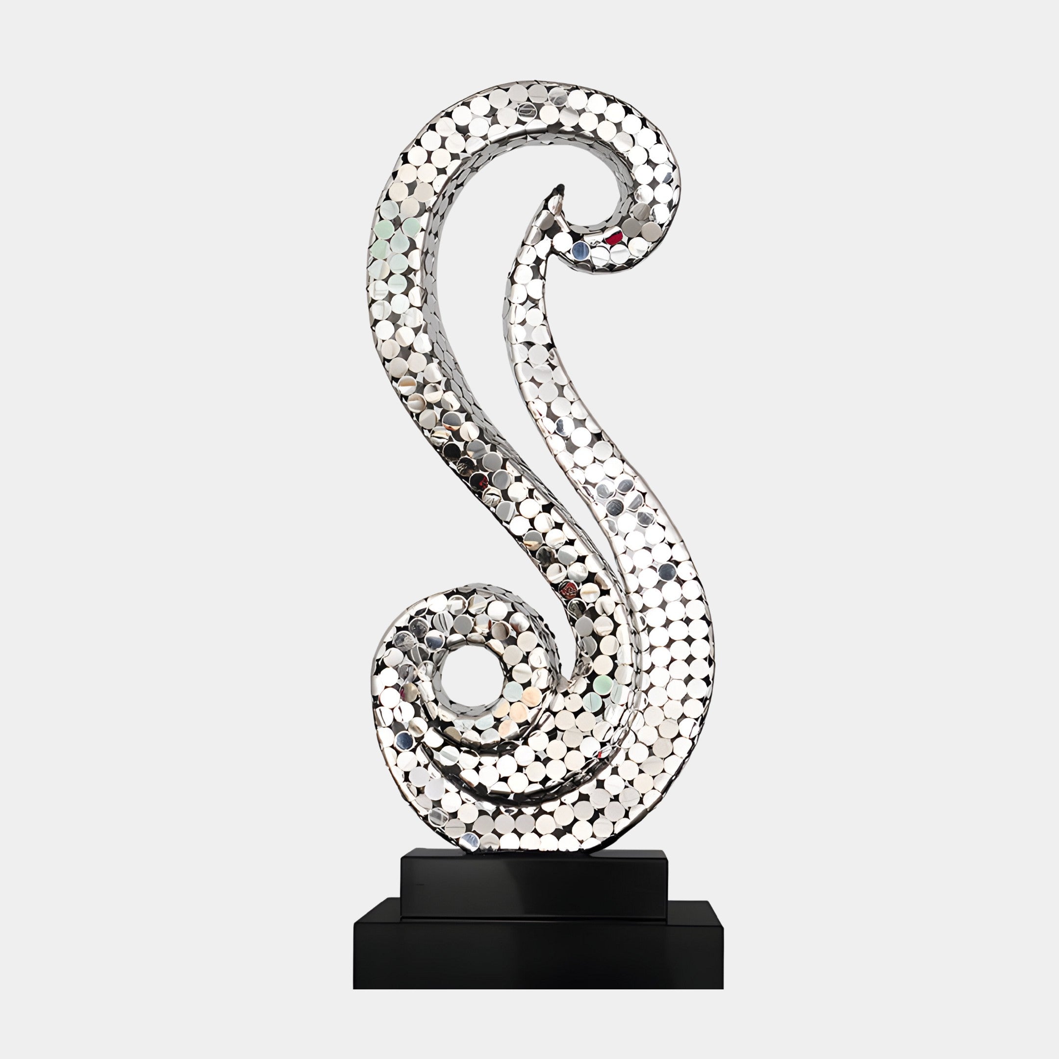 Silver abstract swirling sculpture with a mosaic-like texture, displayed on a black base.