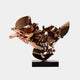 The piece is a contemporary abstract sculpture called "Petal Fusion Copper Organic Steel Sculpture - 70cm" by Giant Sculptures. It boasts reflective copper-like metallic surfaces with sharp and curved edges interlocking and extending upward, all mounted on a rectangular black base against a plain background.