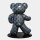 A glossy, gray Gacko Grey LV Bear Sculpture - 165cm by Giant Sculptures stands on a black base. This limited edition pop art piece features the luxury brands iconic monogram design with alternating flowers and initials, boasting a shiny, reflective surface.