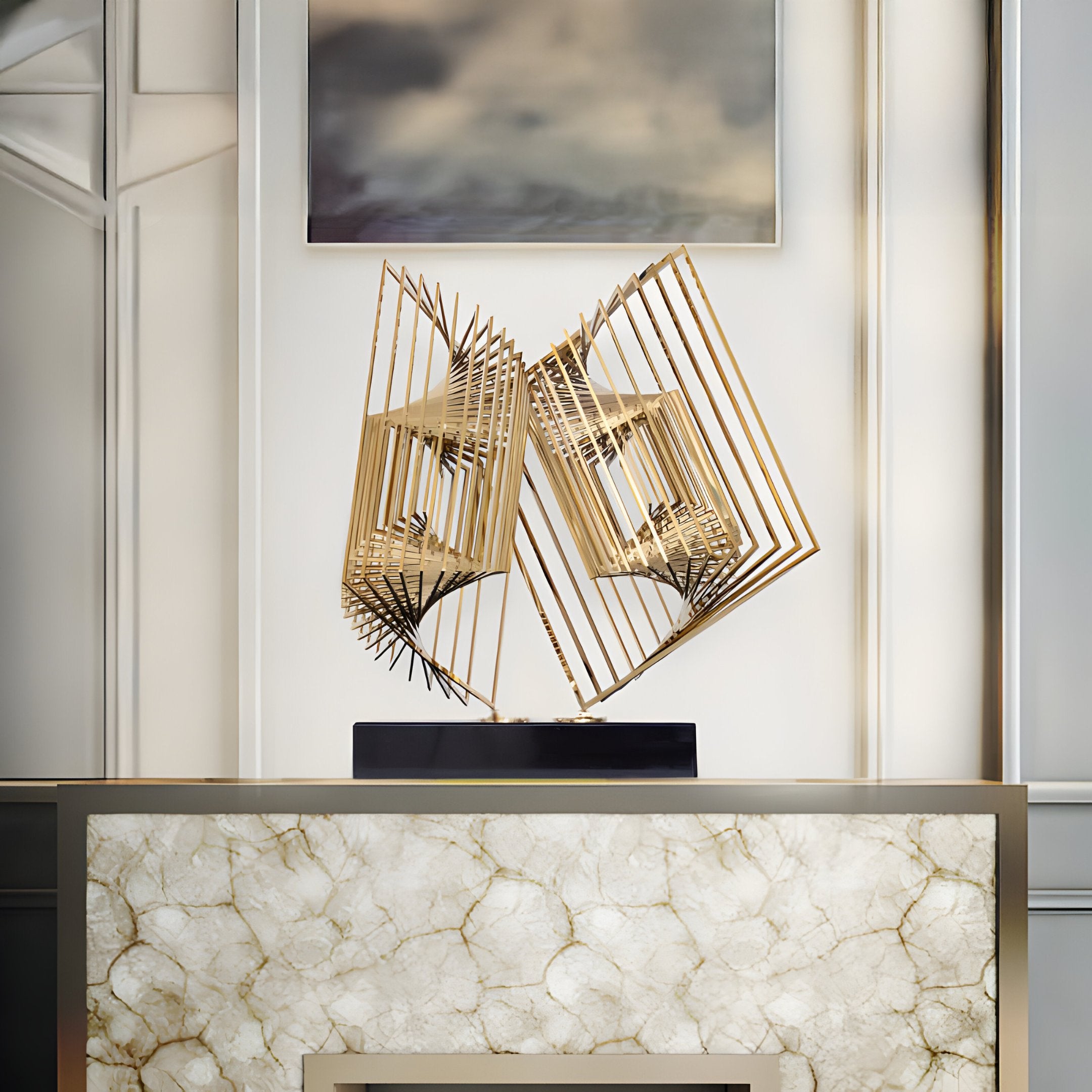 The Quantum Gold Geometric Steel Sculpture by Giant Sculptures, standing at 46cm, is showcased on a rectangular marble pedestal against a cream wall. This captivating piece of modern space decor infuses an artistic flair into the elegant setting.