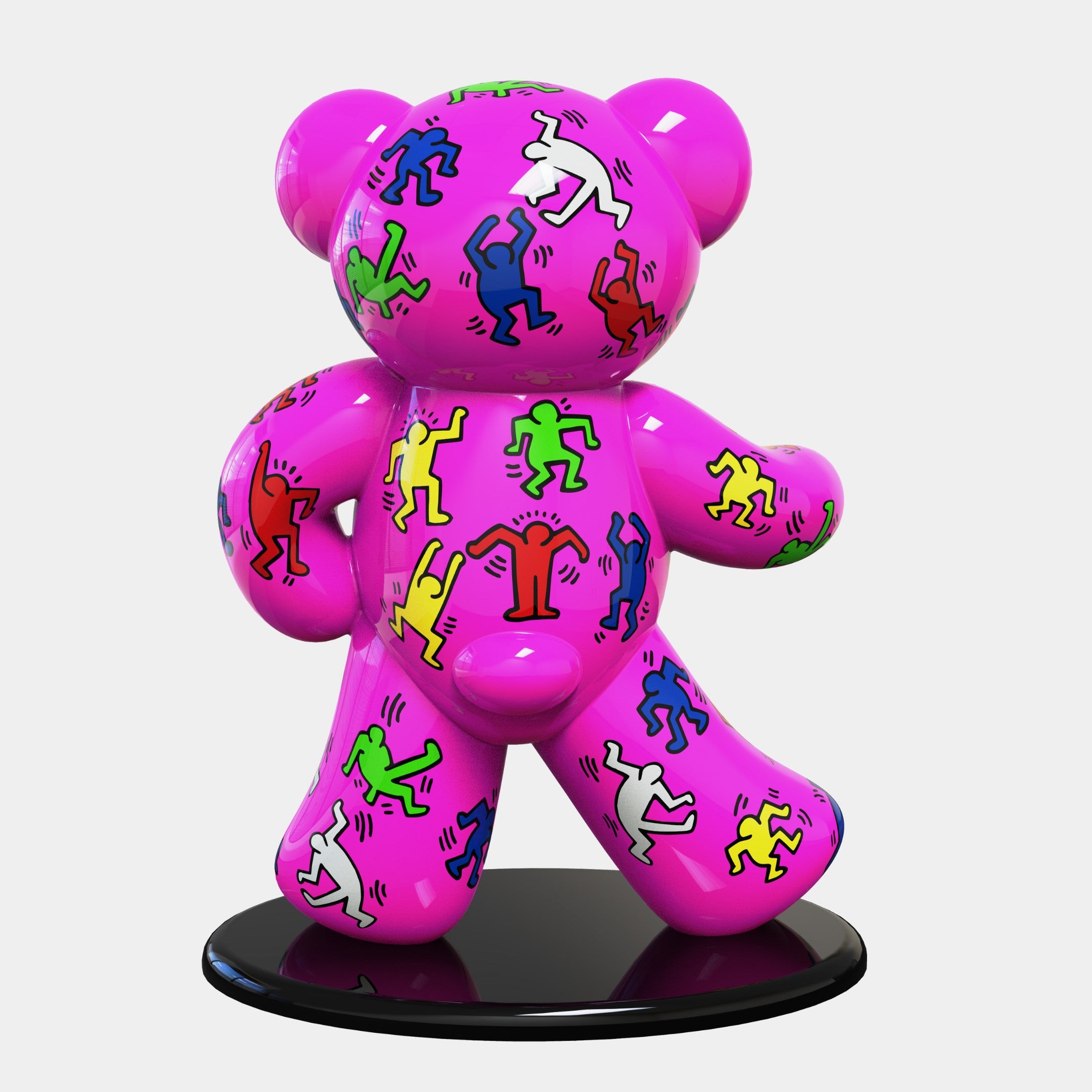 The Gacko Keith Haring Pink Bear Sculpture by Giant Sculptures is 165cm tall and features a pink bear adorned with dynamic, vibrant graffiti figures, embodying pop art. It stands out against a white backdrop on a sleek black circular base.