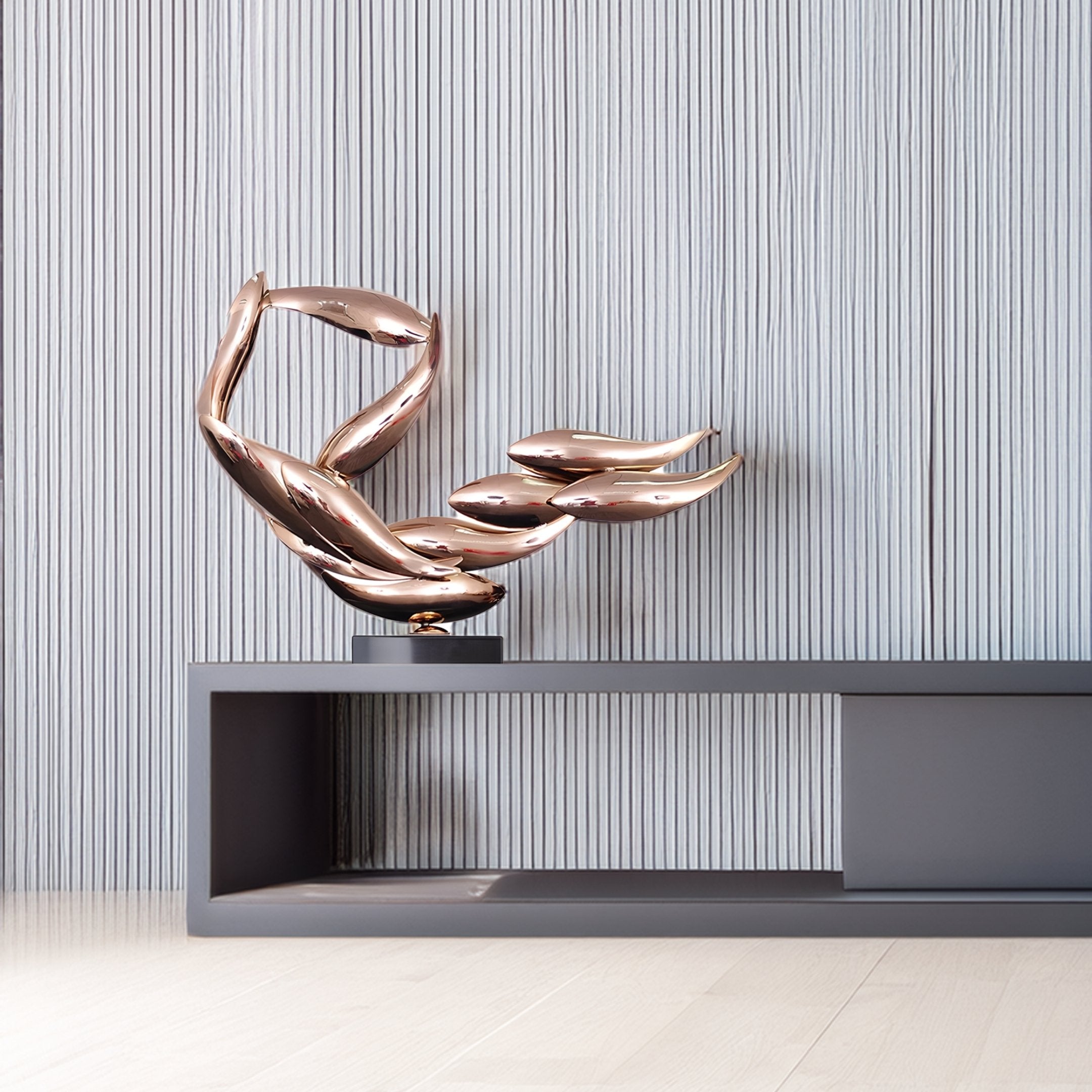 A modern interior features the Breeze Copper Organic Abstract Steel Sculpture by Giant Sculptures on a minimalist gray shelf. Its intertwined steel design with a copper finish enhances the light-colored wall and pale wooden floor, adding elegance to contemporary decor.