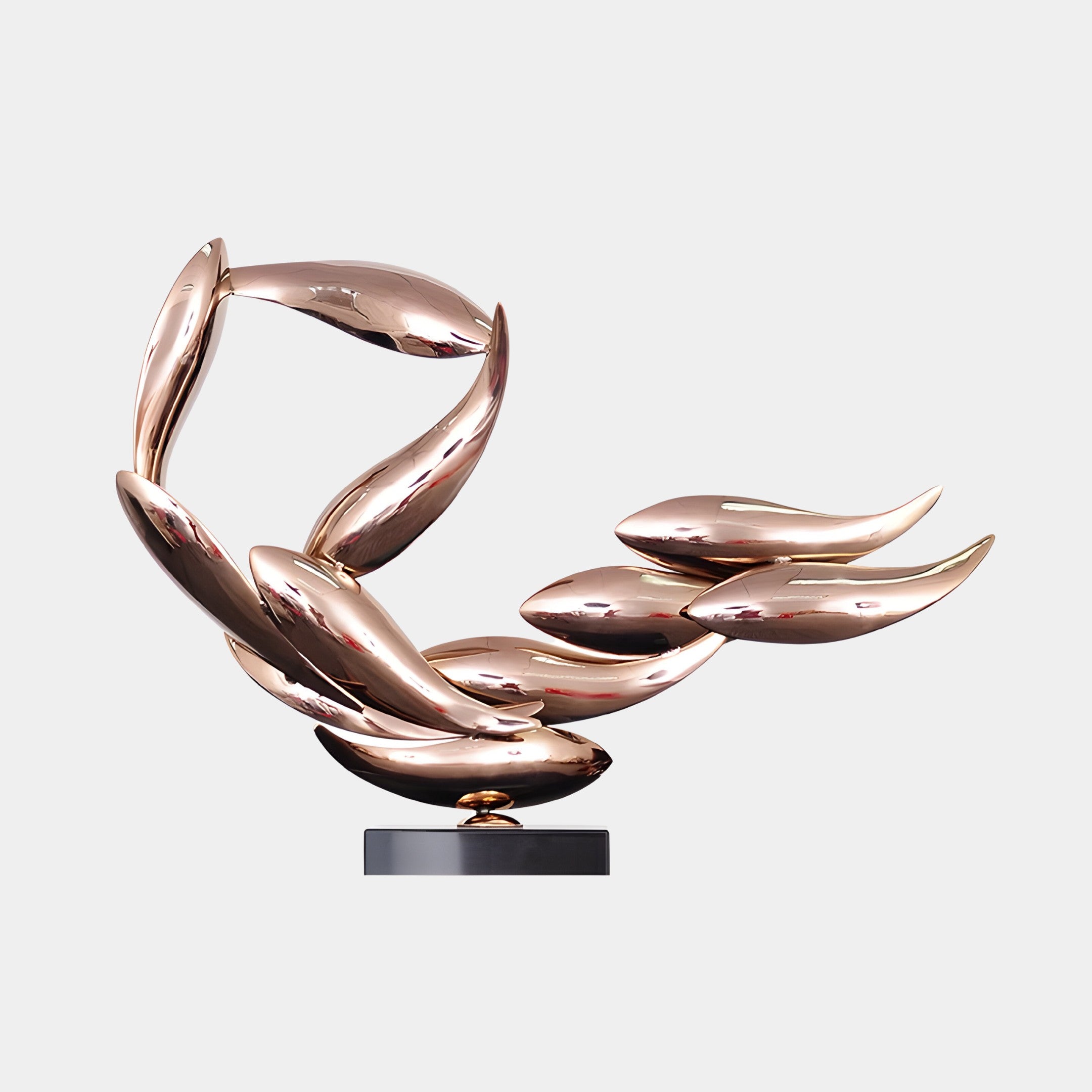 The Breeze Copper Organic Abstract Steel Sculpture - 50cm by Giant Sculptures features a flowing, dynamic design with elongated, curved elements resembling leaves or wings in shiny copper. Mounted on a circular black base, it adds a modern touch to any space.