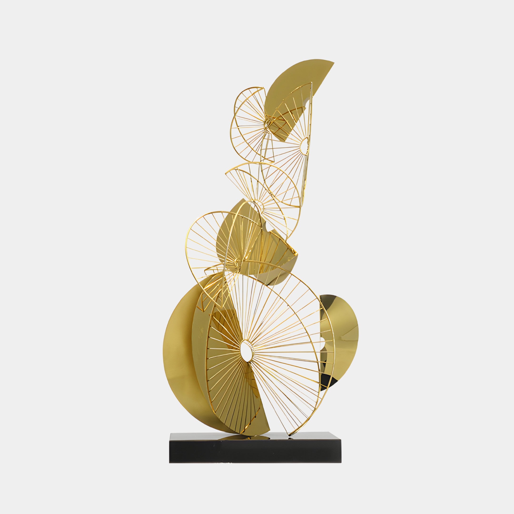 Gold sculpture made of wireframe-like elements, combining circular and angular shapes on a black base.