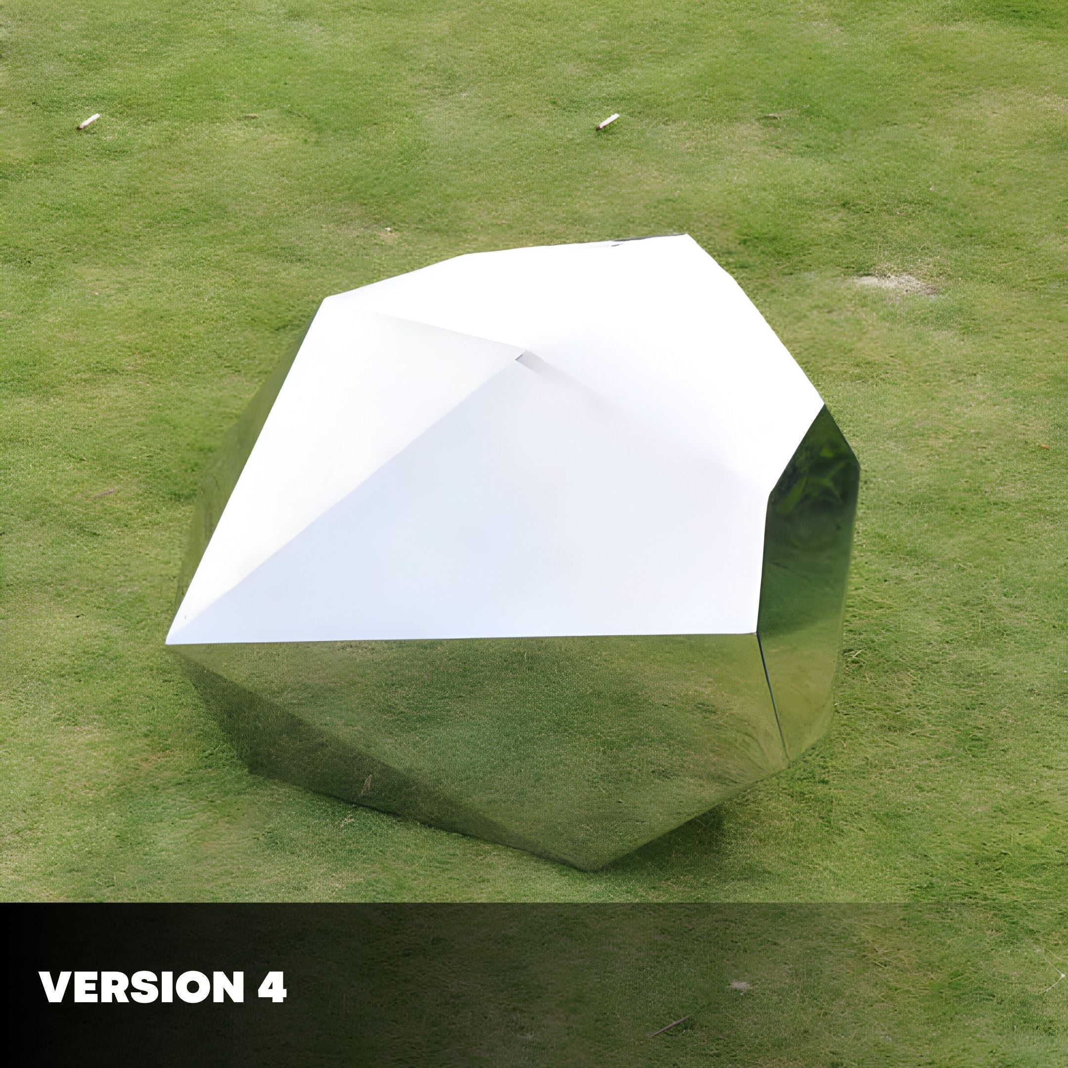 A shiny, angular metallic structure with a white top surface stands on grass, exuding contemporary elegance like a faceted gemstone. Version 4 appears in white text on a black rectangle at the bottom left corner. This is the Tetra Geometric Steel Rock Sculpture by Giant Sculptures.