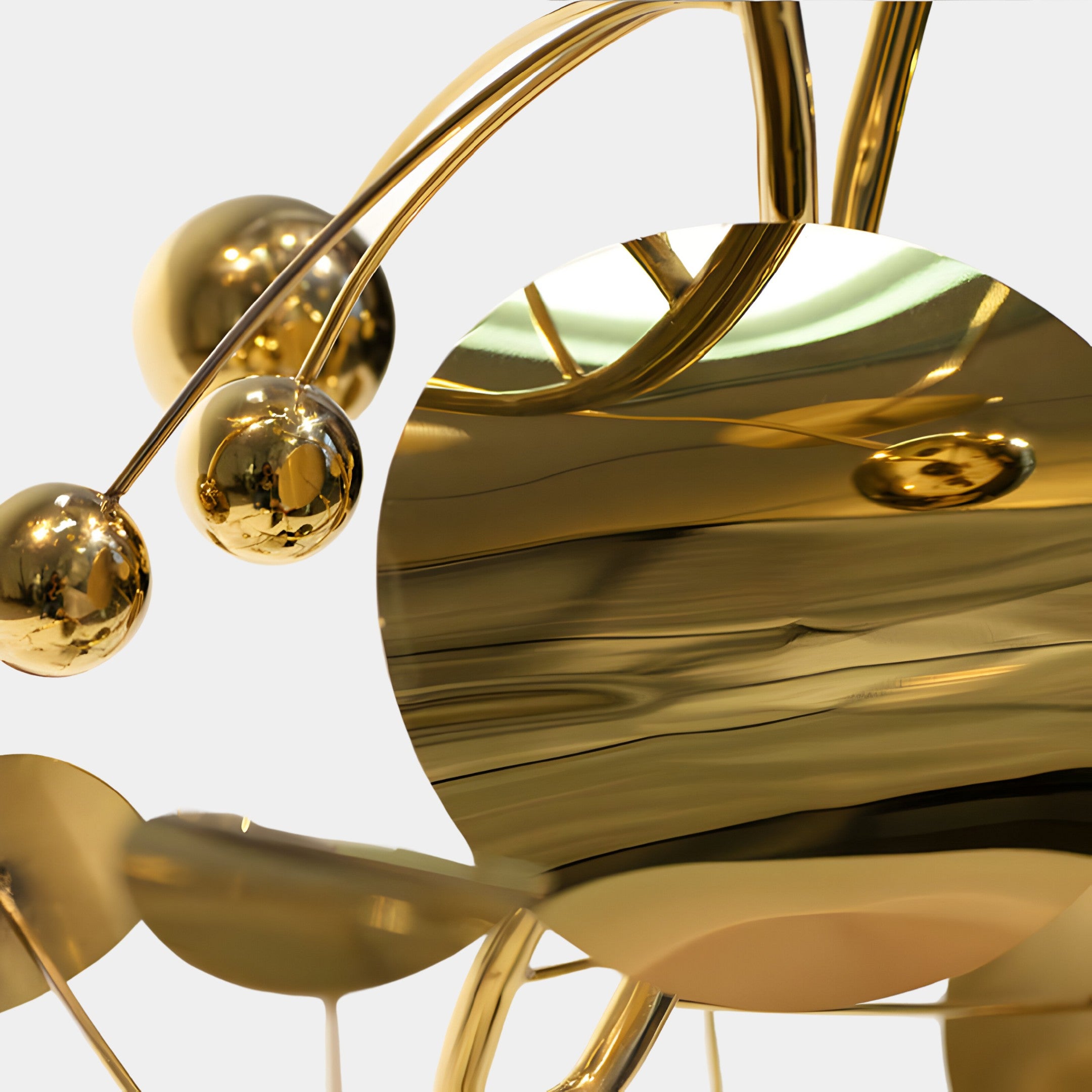 Close-up view of the gold sculpture showing the glossy surface and reflective texture.