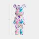 50cm Muse Metro bear sculpture with bold brush strokes of purple, teal, and pink on a white base, front view.