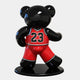 The Gacko Chicago Bulls Bear Sculpture by Giant Sculptures is a glossy, black fiberglass bear figure, 165cm tall, sporting a red Bulls jersey with the number 23. It stands on a round black base, designed in André Gacko’s playful style to showcase the back of the jersey and its shiny finish.