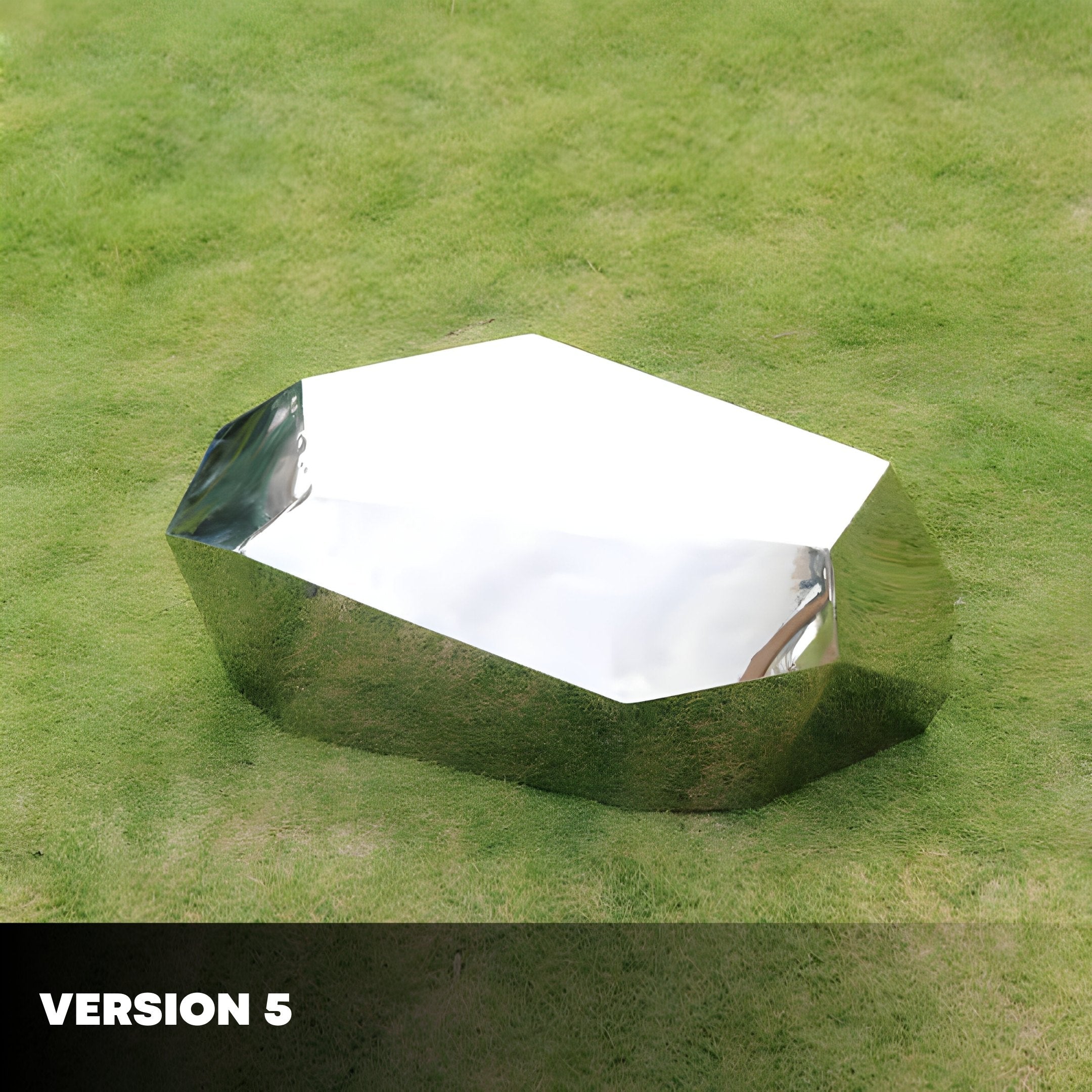 A shiny, metallic, faceted object with a geometric shape rests on a green grassy surface. It looks like one of the Tetra Geometric Steel Rock Sculptures by Giant Sculptures. Text in the bottom left corner reads VERSION 5.