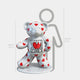 The Gacko Keith Haring White Bear Sculpture by Giant Sculptures is a 130cm glossy white bear adorned with red hearts and a cartoon heart on its chest. It stands on a round base and is shown beside a grey human outline for scale.