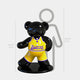 The Gacko Lakers Bear Sculpture - 130cm by Giant Sculptures features a glossy bear in a yellow uniform on a black base, standing beside a height chart—a bold pop art piece ideal for modern basketball-inspired spaces.