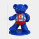 The Gacko Sailor Bear Sculpture - 70cm by Giant Sculptures is a shiny blue nautical pop art bear in a red and white striped outfit with red buttons, standing on a circular base against a plain white background. Limited edition.