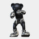 The Gacko Electroplated Chrome LV Boxer Bear Sculpture (80cm) by Giant Sculptures features a black bear in a boxing pose with chrome gloves, shorts, and star-detailed boots—a bold, limited edition art piece shown on a plain white background.