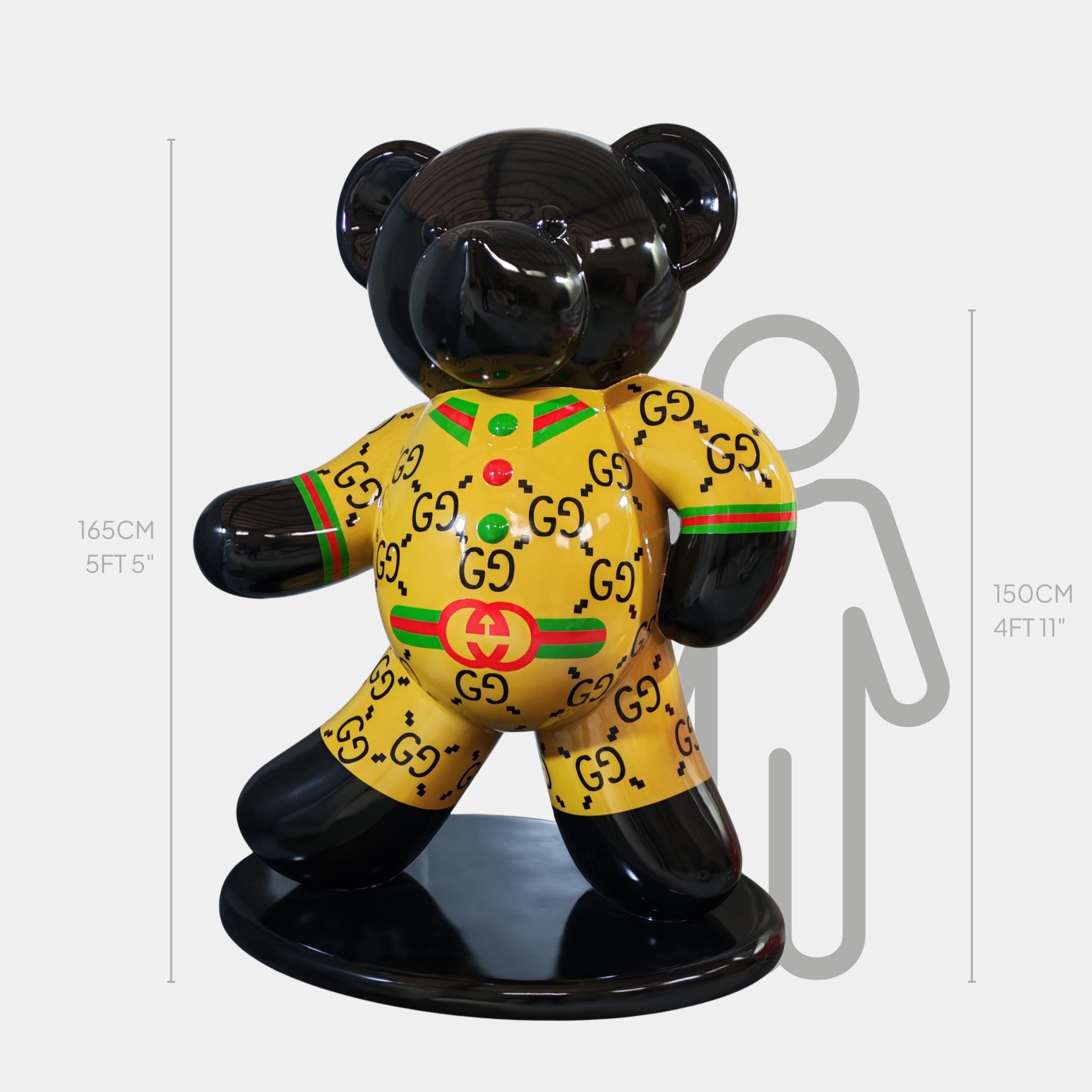 The Gacko Gucci Bear Sculpture - 165cm by Giant Sculptures features a glossy black bear in a yellow, Gucci-inspired outfit on a black base, bringing bold pop art luxury to your space with its striking design and impressive height.