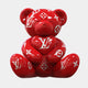 The Gacko Red LV Love Bear Sculpture - 80cm by Giant Sculptures features glossy red hues with white Louis Vuitton logos and floral patterns, sitting upright against a plain backdrop as a bold limited edition collectible and pop art piece.