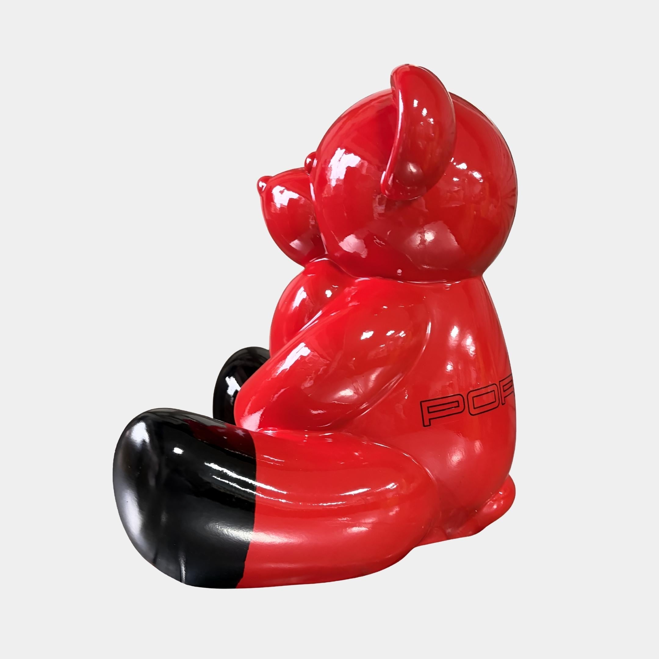 Side profile of the 80cm Gacko Porsche Love Bear Sculpture, showing the seated posture, gloss black paws and the tonal red-on-red PORSCHE wordmark across the flank.