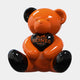 The Gacko Hermes Love Bear Sculpture - 160cm by Giant Sculptures is a glossy orange and black teddy bear holding a black heart with the Hermès Paris logo in orange, sitting upright against a white background.