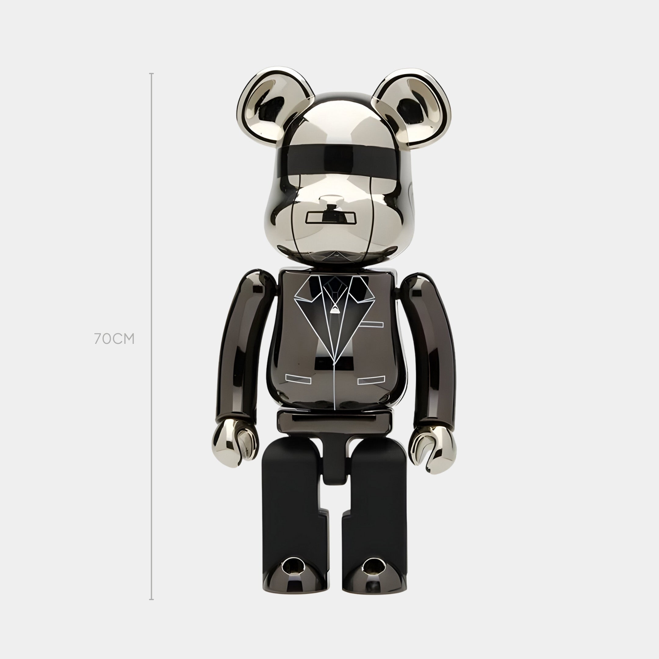The Giant Sculptures Gala Chrome Bear Sculpture - 70cm is a mirror-finished bear figurine with round ears, simple features, and a tuxedo chest design. It stands upright with a scratch-resistant top-coat for lasting shine.