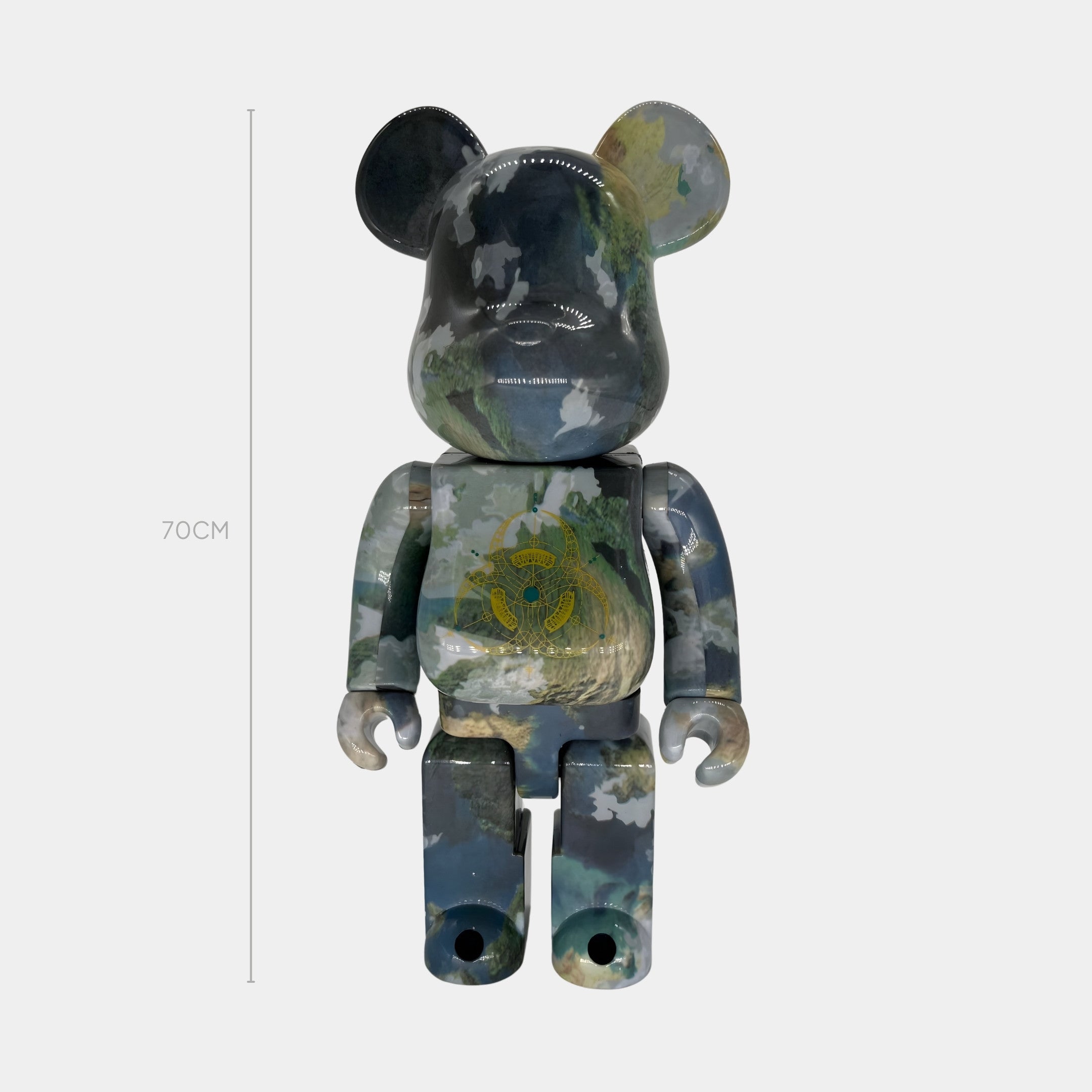 The Giant Sculptures Geo Emblem Bear Sculpture - 70cm stands against a plain white background, featuring a glossy finish, hydro-dipped with a cloudy sky pattern and adorned with a gold ornate crest on its chest.