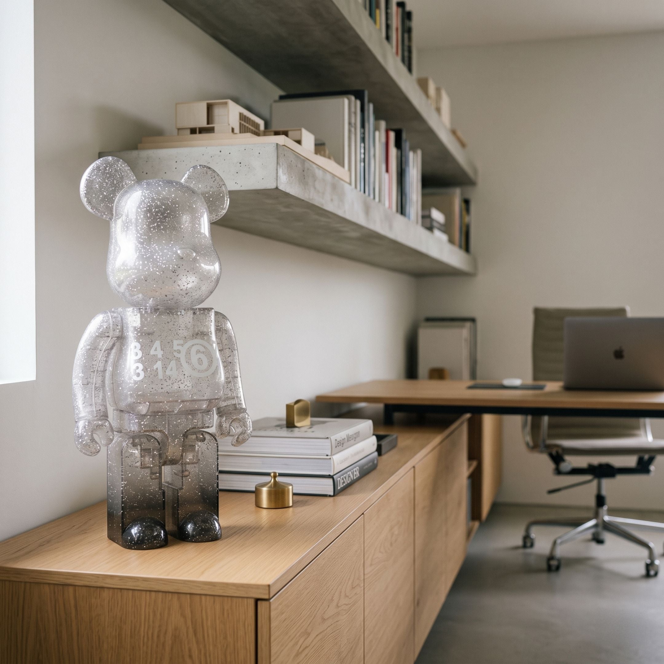 Glitter Gradient Bear Sculpture - 70cm in high-gloss resin with grey glitter gradient finish, displayed on a wooden credenza in a home office beside shelves and a desk.