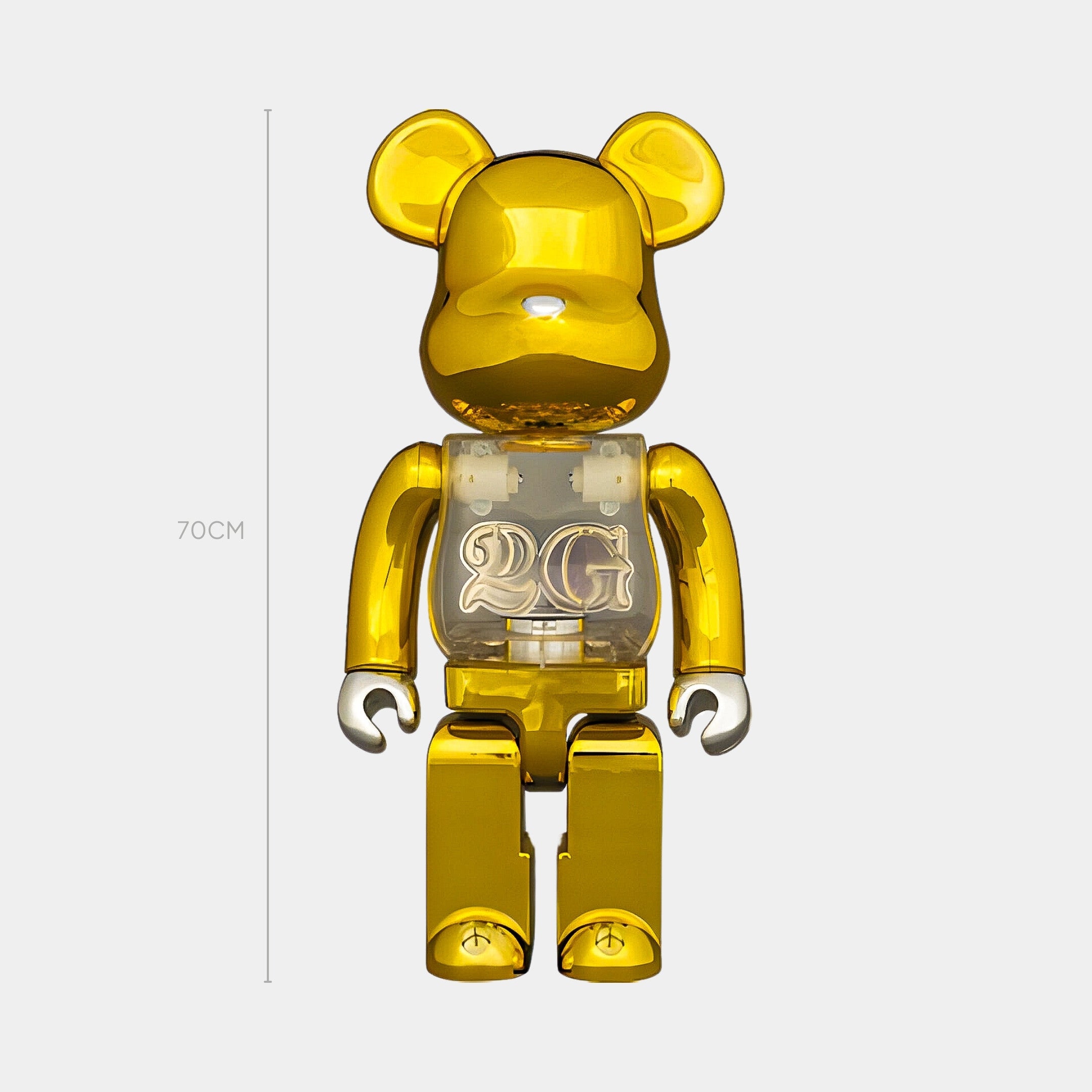 The Nexus Gold Bear Sculpture - 70cm by Giant Sculptures, with electro-plated gold chrome finish, stands upright. A transparent chest displays 2G, emphasizing its limited-edition status against a light gray background.