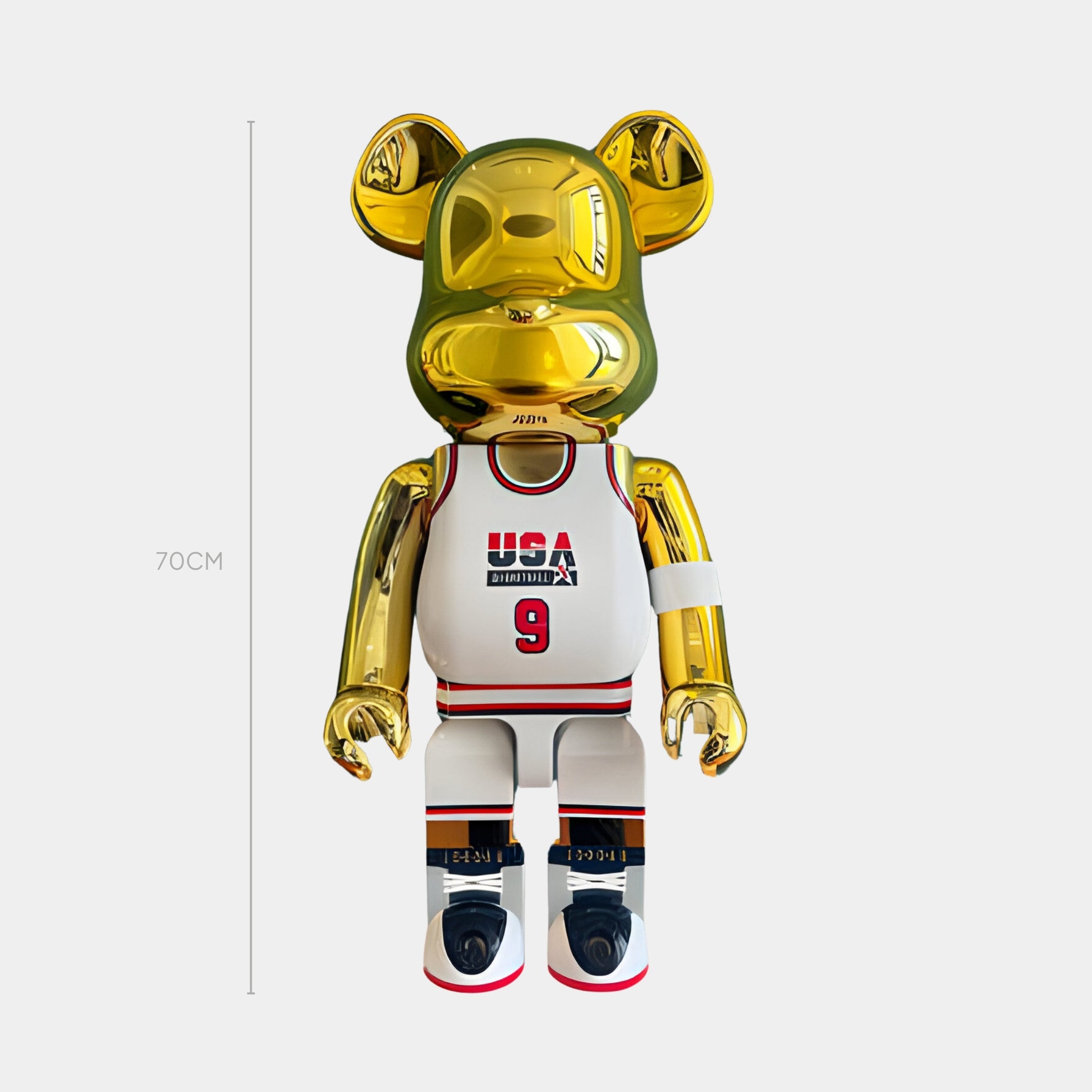 The Giant Sculptures Gold Hoops Bear Sculpture - 70cm shines with a luxe finish, wearing a white USA jersey (#9), black shorts, and red, black, and white sneakers—celebrating hoops heritage in golden style.