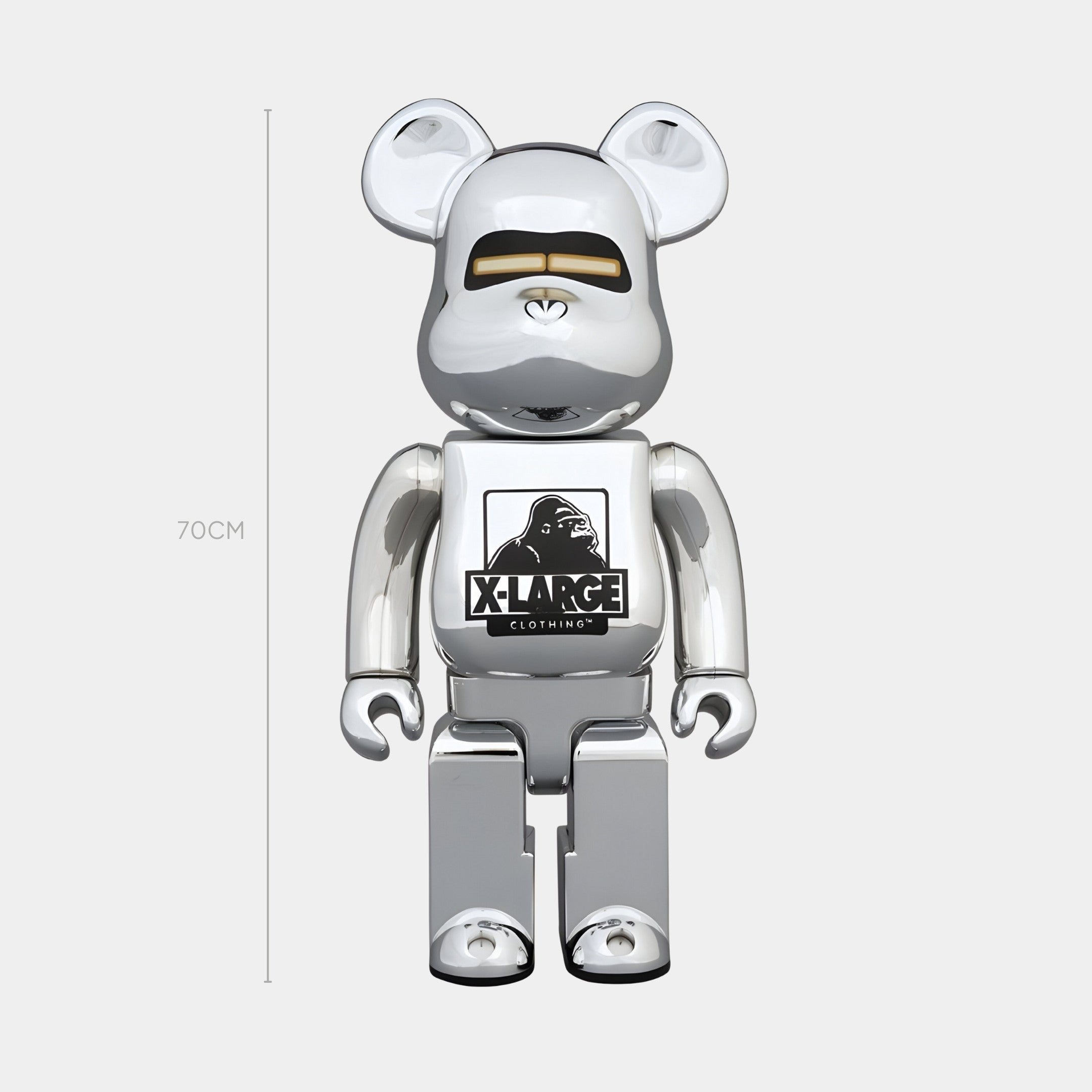 The Giant Sculptures Gorilla Crest Chrome Bear Sculpture - 70cm stands boldly on a white background, boasting a shiny silver finish, black eyes and nose, and the XLARGE gorilla crest on its chest.