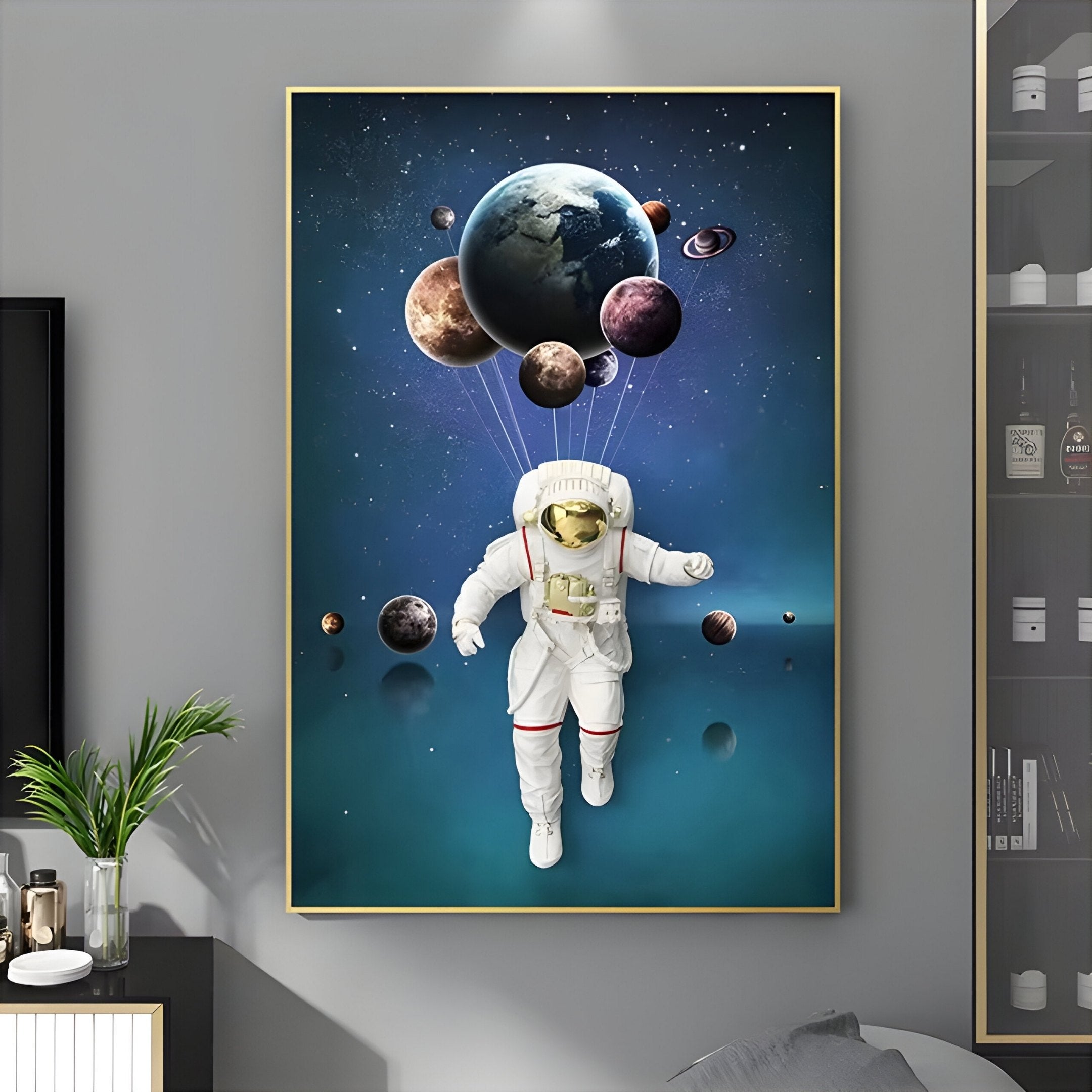 The White 3D Space Astronaut Planet Balloons Wall Art by Giant Sculptures showcases a serene scene of an astronaut with planet balloons against a starry backdrop, enhancing modern rooms when paired with plants and shelves.