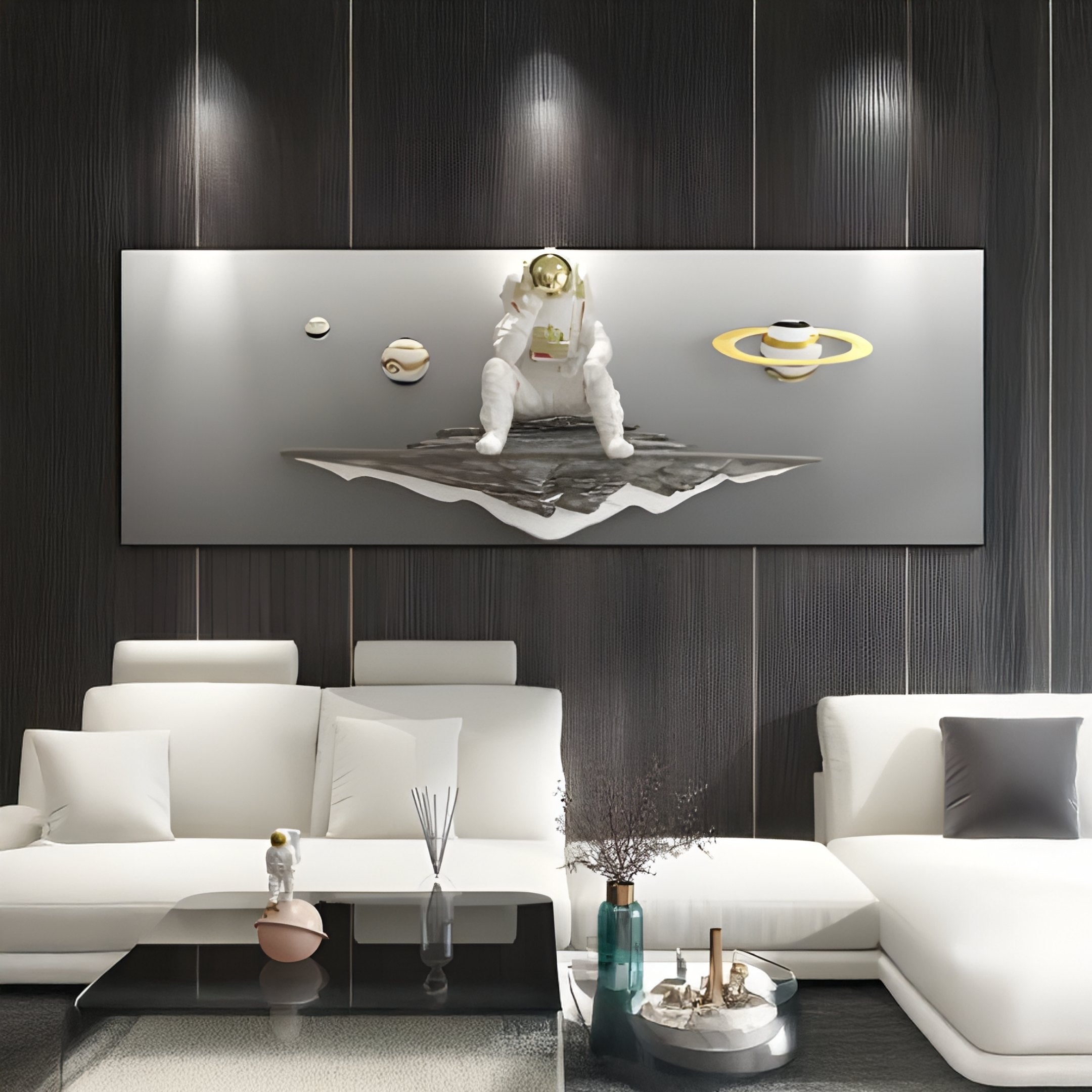 A modern living room features the White 3D Galaxy Astronaut Thinker Linear Wall Art by Giant Sculptures, showcasing an astronaut with planets. Complemented by white couches, a glass coffee table, decorative items, and subtle lighting seamlessly enhance the cosmic décor.