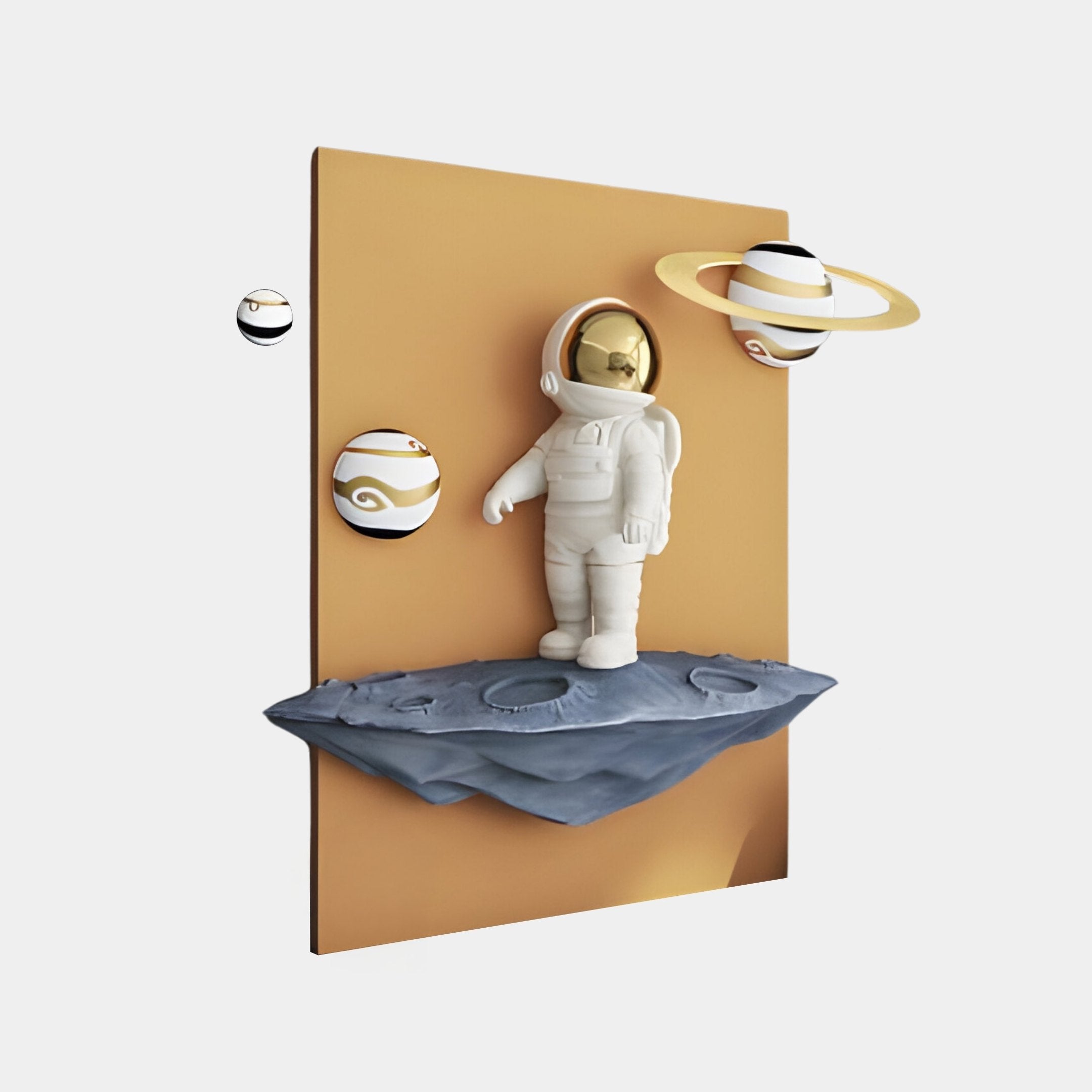 The White 3D Stellar Astronaut Wall Art by Giant Sculptures depicts an astronaut on a rocky platform, surrounded by three floating planets—one with rings—against a tan backdrop, all captured in the astronauts reflective helmet.