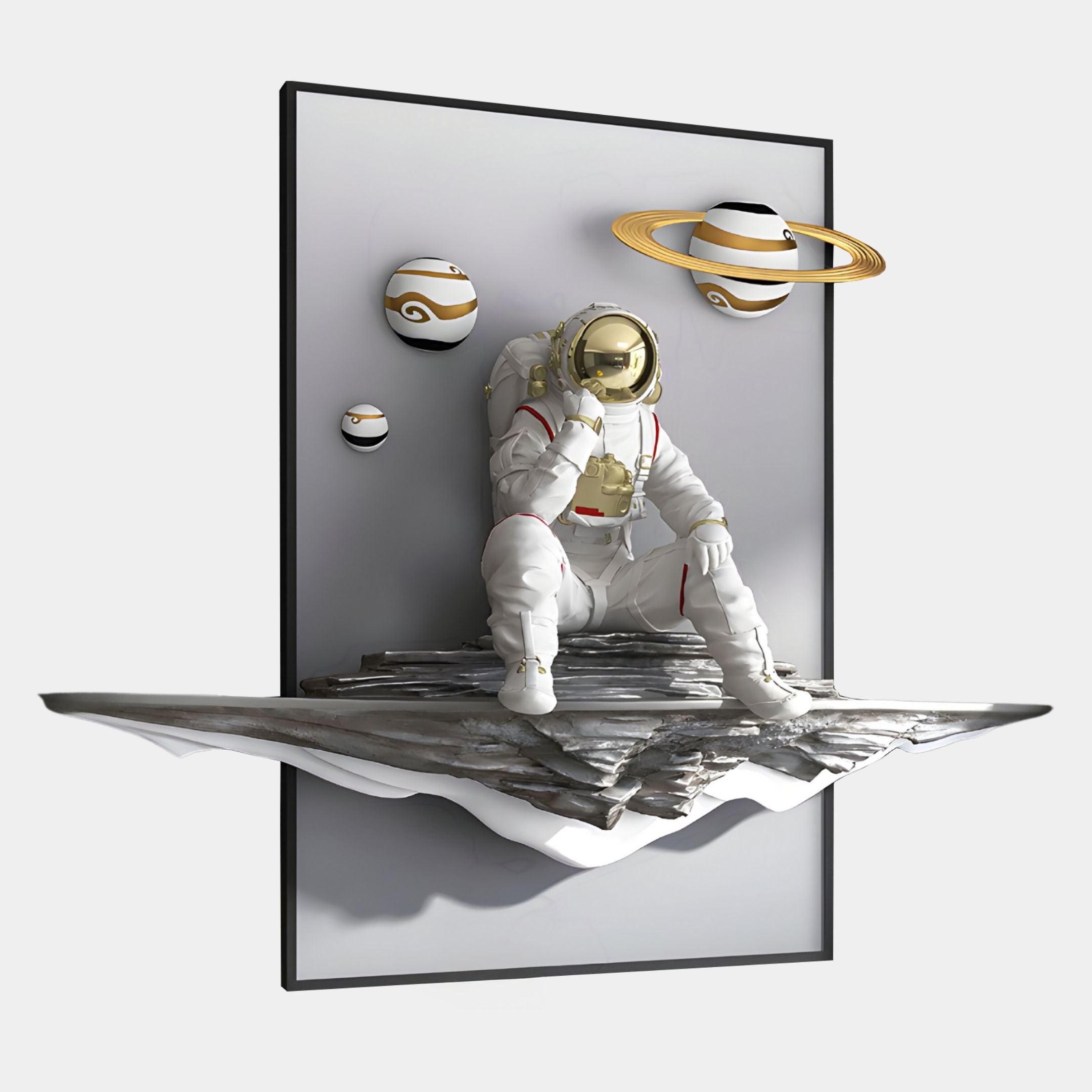 The Giant Sculptures White 3D Galaxy Astronaut Thinker Wall Art features a contemplative astronaut on a rocky platform, partly emerging from the frame, with three decorative spheres—including one with a golden ring—set against a light background.