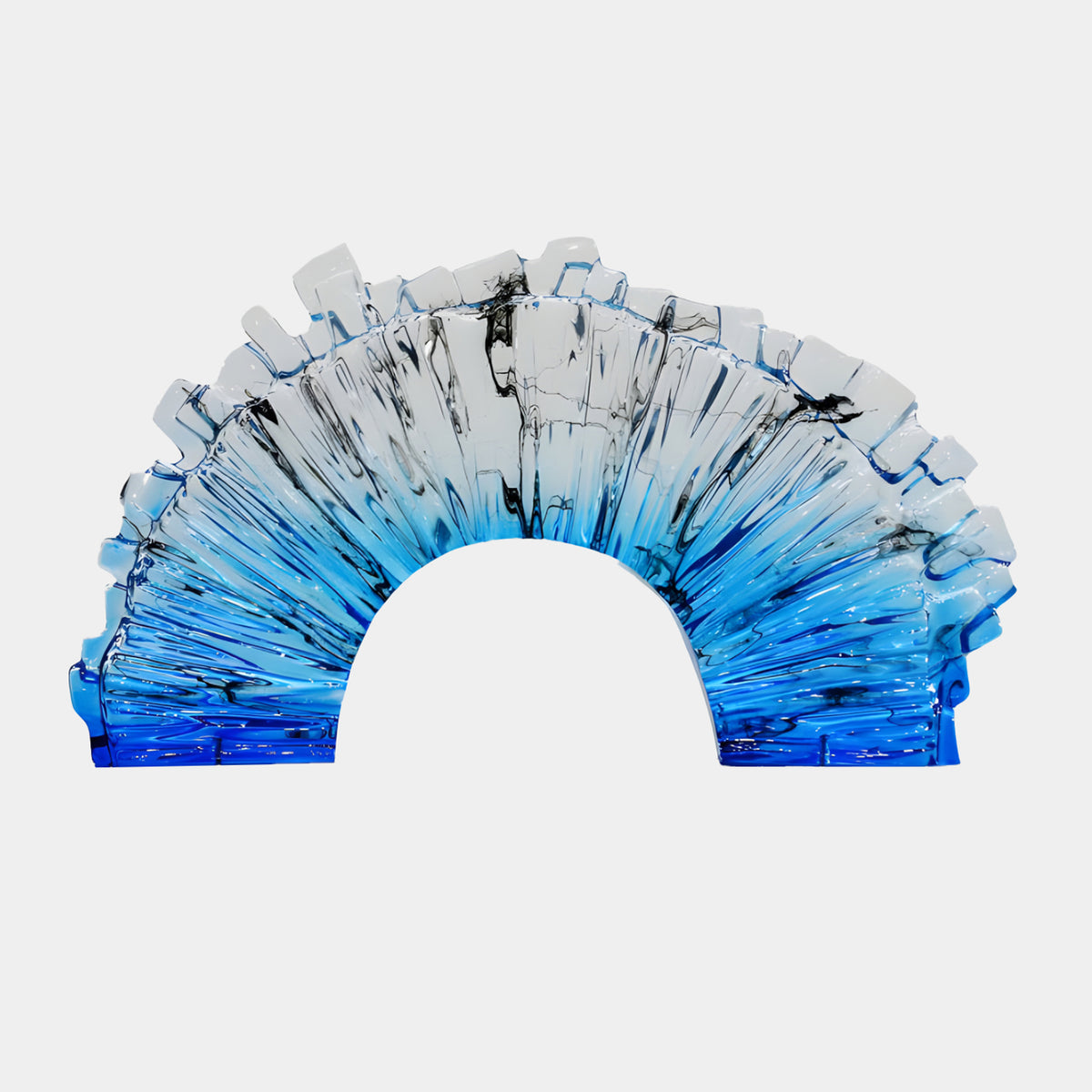 Blue & Clear Fluted Crenellated Arch Resin Sculpture, 68cm, fluted ribs grading from cobalt blue feet to clear crenellated crown, black ink wisps, on a plain white background.