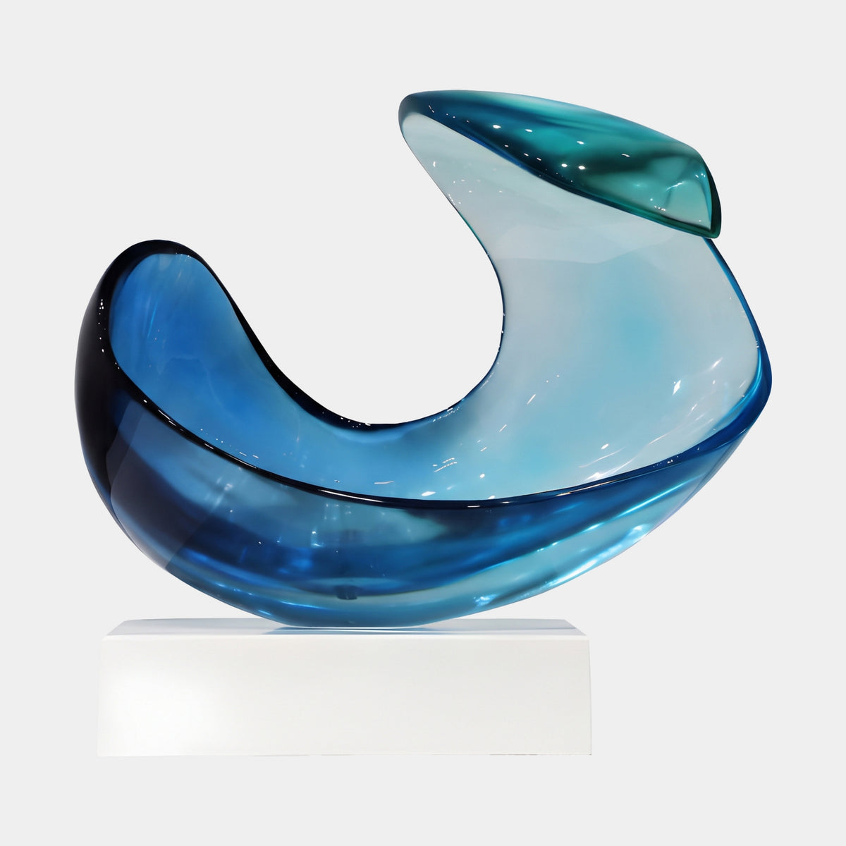 Blue Curling Sheet Scoop Resin Sculpture on Marble Base, 39cm, showing a boat-shaped bowl darkening to navy with a curling teal-capped sheet, on a white platform against a plain background.
