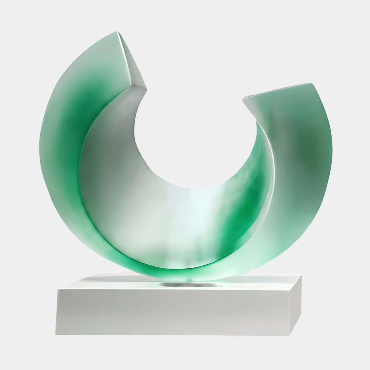 Green & White Frosted Open Ring Resin Sculpture, 42cm, open curved band in frosted resin with emerald green clouding, set on a white marble base.