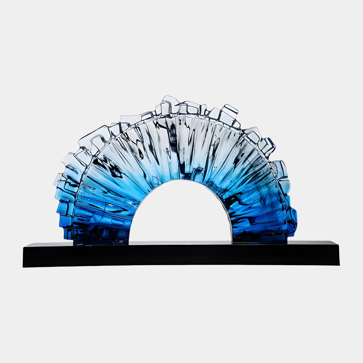 Blue & Clear Graded Block Fan Resin Sculpture, 95cm, a fluted half-ring arch on a black base, graded from deep blue to clear with a crenellated rim, on a plain white background.