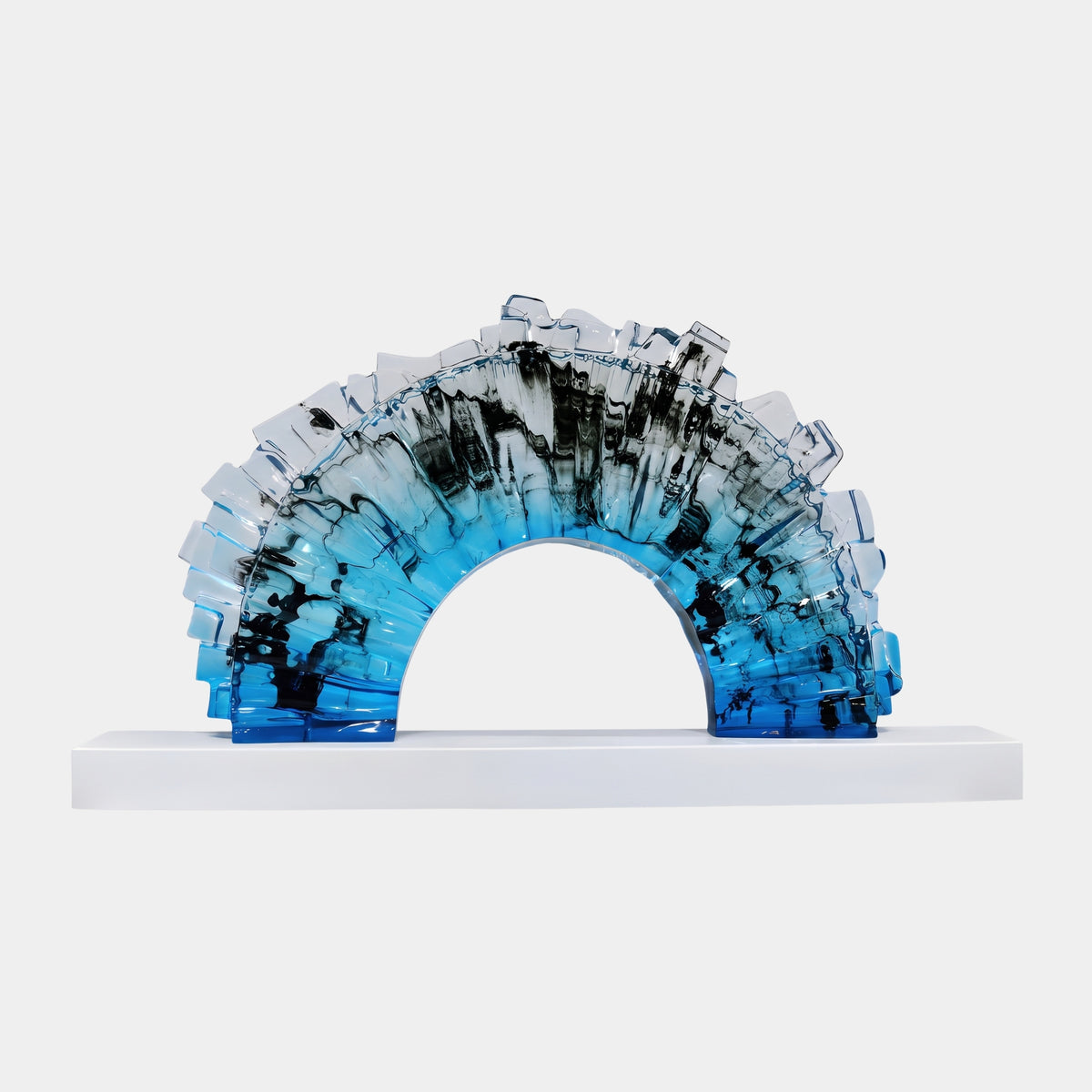 Sky Blue & Black Ink-Marbled Block Fan Resin Sculpture, 95cm arch with ribbed clear blocks and smoky black patches over blue, on a white base against a plain background.