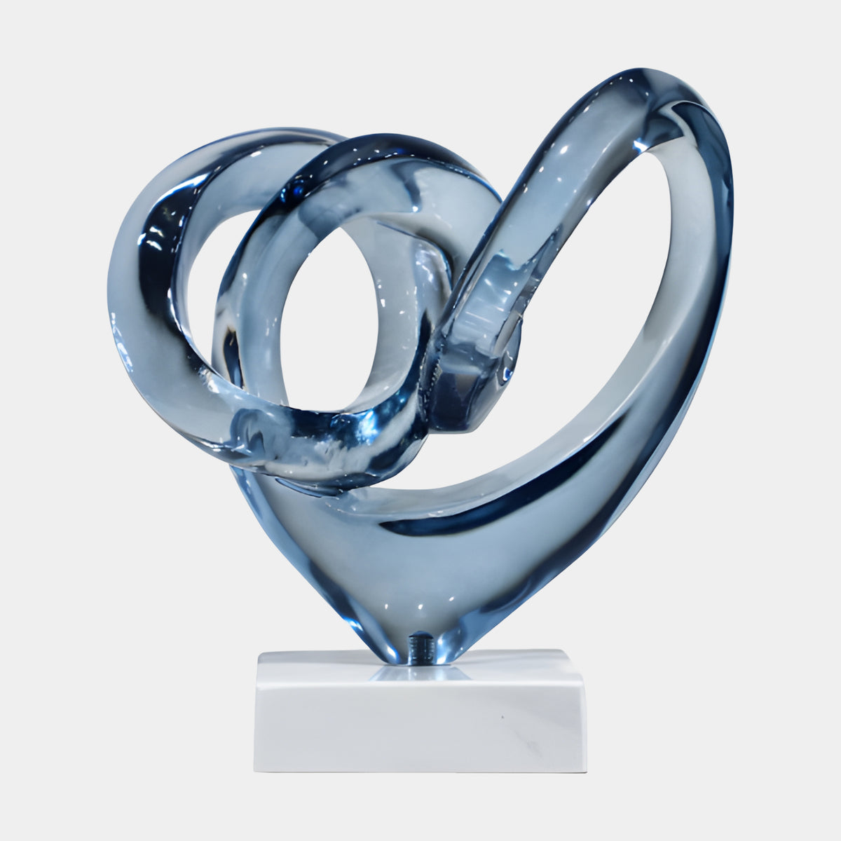 Smoke Blue Knotted Triple Loop Resin Sculpture, 24cm, glossy blue resin loops forming a heart-like knot on a white block base, plain white background.