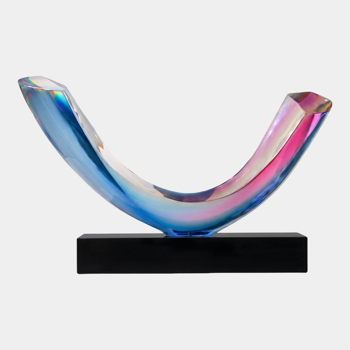 Multi-Colour Iridescent Upturned Arc Resin Sculpture (134cm) by Giant Sculptures, a U-shaped curved bar in blue, violet and pink tones on a black marble base, shown against a plain white background.