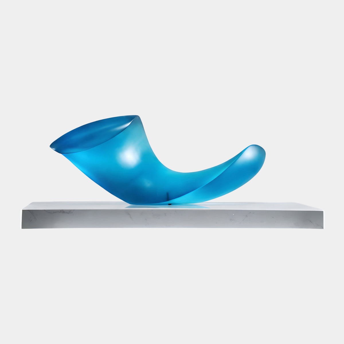 Turquoise Frosted Folded Sweep Resin Sculpture - 60cm, a curved sweep with a flared oval face and folded tail, on a white platform against a light grey background.