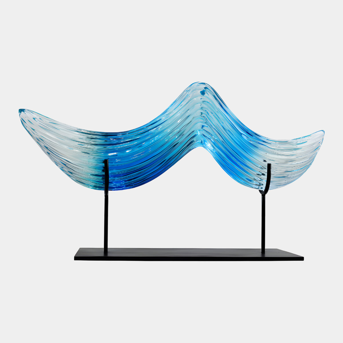 Wide Blue Combed Wave Sheet Resin Sculpture, 78cm, blue fading to clear with fine ridged lines, mounted on a black metal stand against a plain white background.