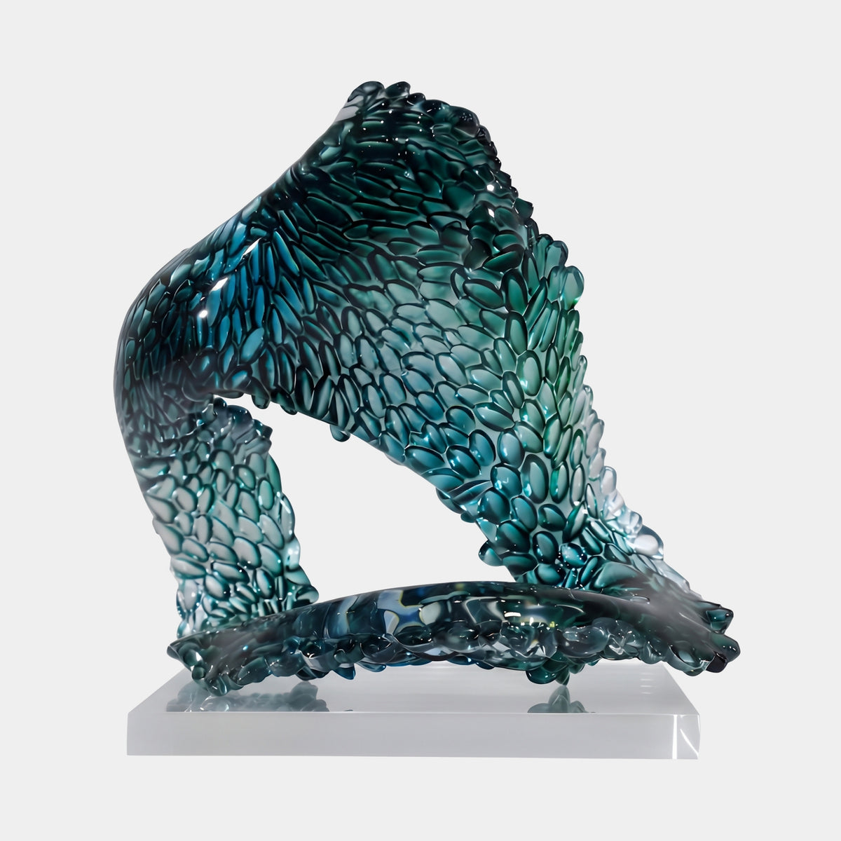 Teal Scaled Arch Mass Resin Sculpture - 33cm, an arched resin form covered in overlapping scales fading from teal to clear, on a clear block base against a white background.