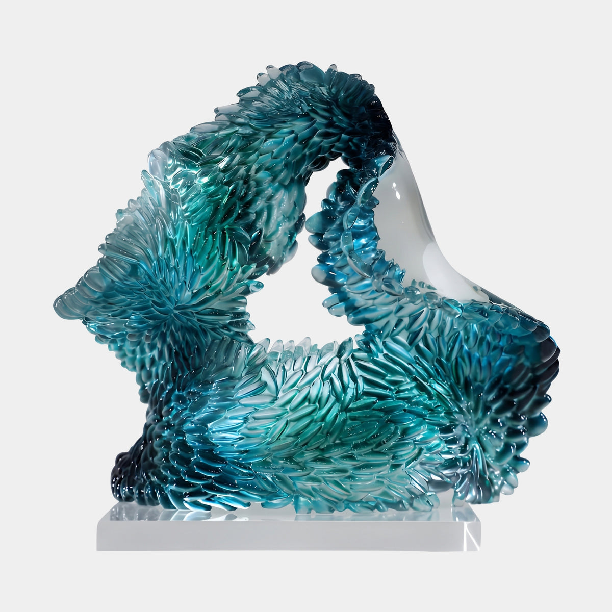 Teal Scaled Channelled Loop Resin Sculpture - 35cm, a closed loop form with scaled texture deepening to navy, set on a clear block against a plain white background.