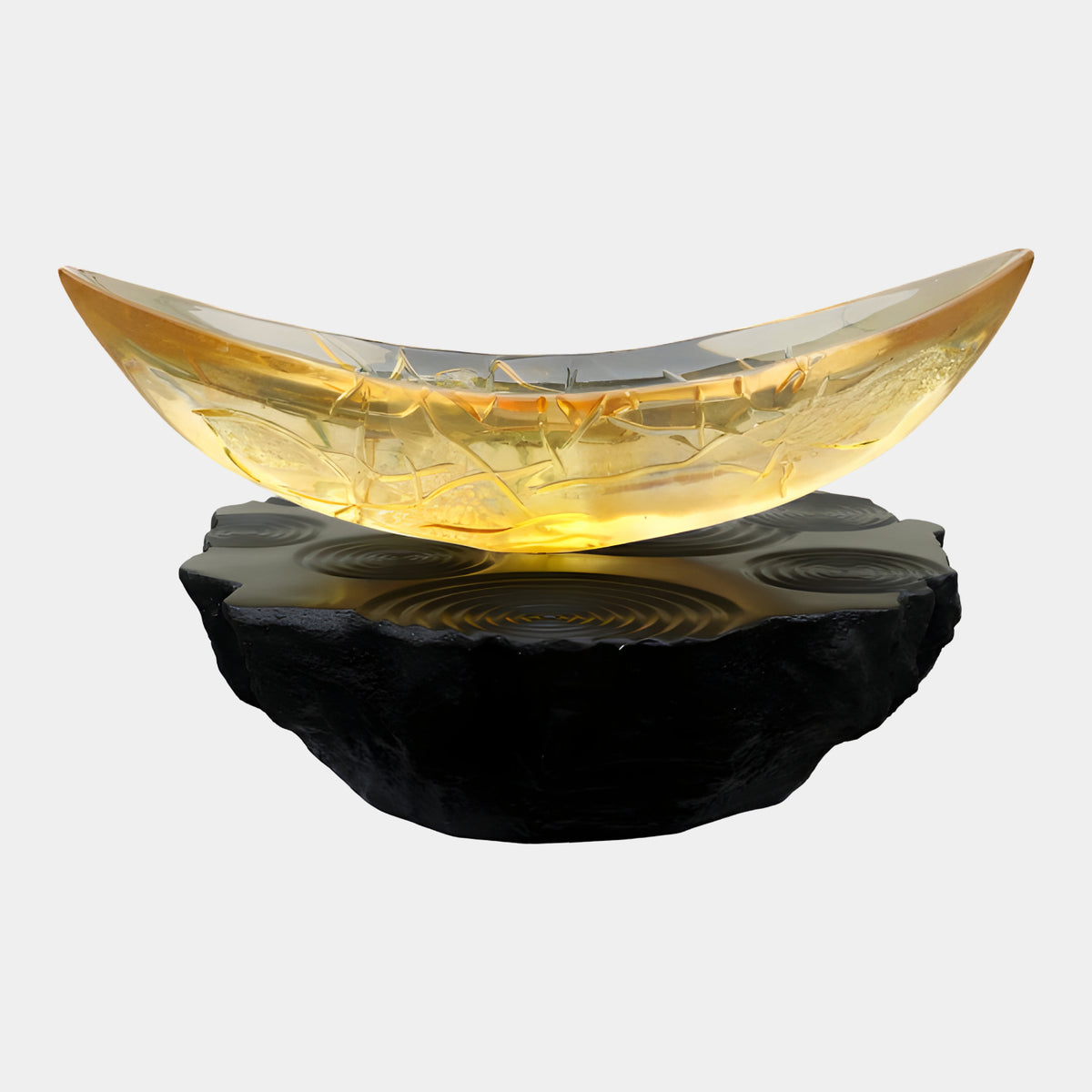 Amber Veined Solid Boat Resin Sculpture (173cm) by Giant Sculptures, a crescent-shaped golden resin boat with crackled veins on a rough dark stone base, white background.