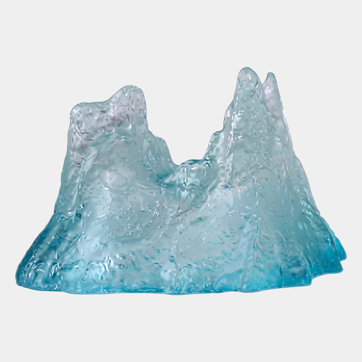 Aqua & Frosted Saddle Peak Resin Sculpture, 30cm, twin-peaked mountain form with crinkled texture, aqua base fading to frosted white peaks, on plain white background.