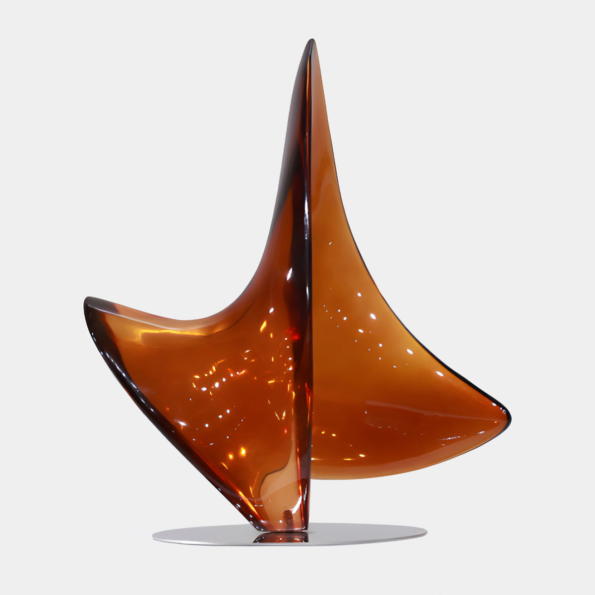 Amber Three-Fin Dart Resin & Steel Sculpture - 63cm, three swept amber-to-red-brown fins on a round steel base, shown against a plain white background.