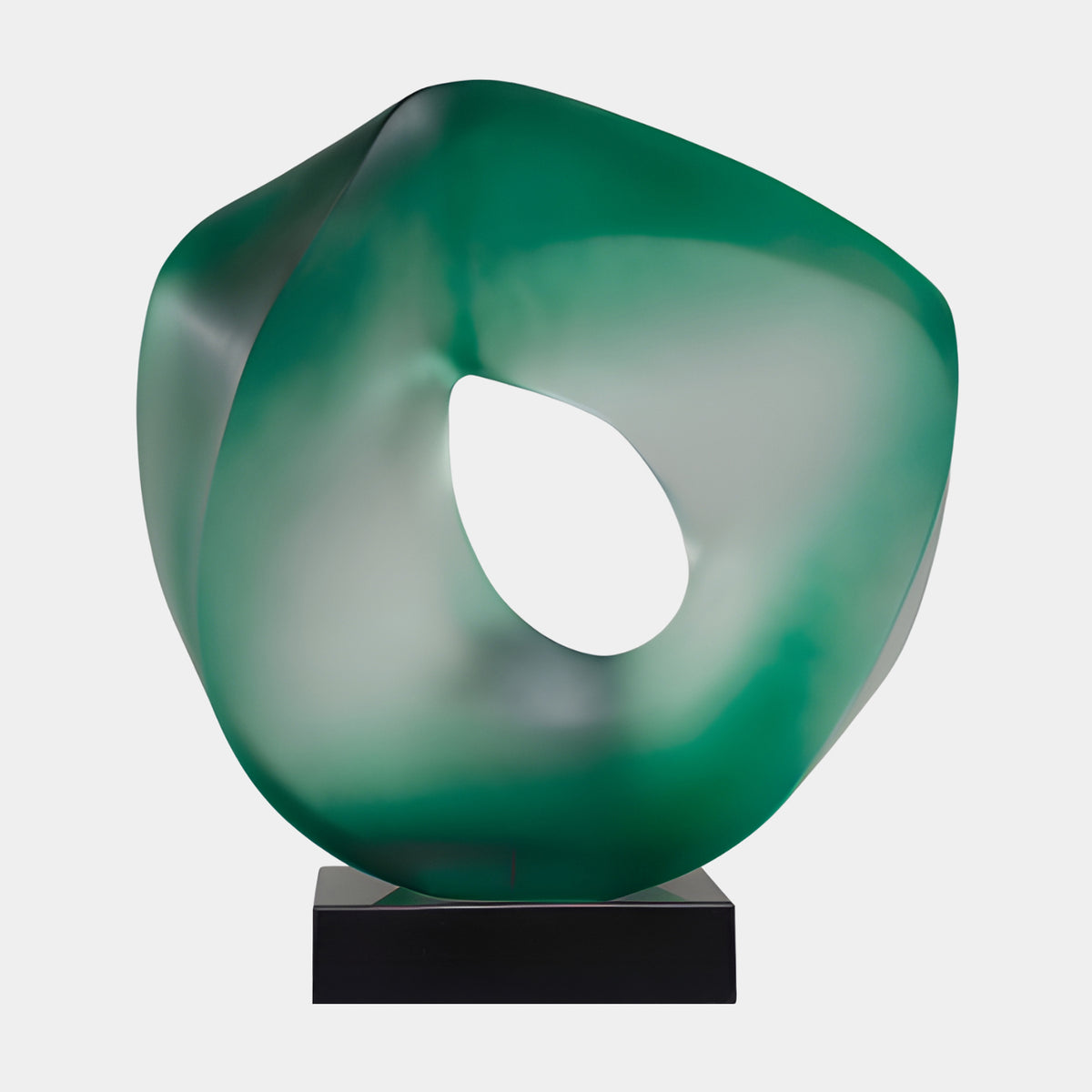 Green Frosted Pierced Ring Resin Sculpture - 55cm, a twisted green resin ring with teardrop opening on a black marble base, set against a plain light background.
