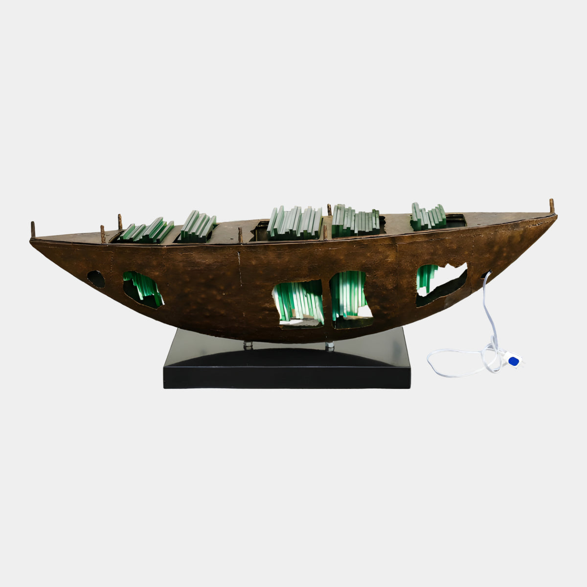 Brown & Green Cargo Boat Metal & Acrylic Sculpture, 140cm, dark brown metal hull with cutout openings and green acrylic slabs on deck, on a black stand against a plain white background.