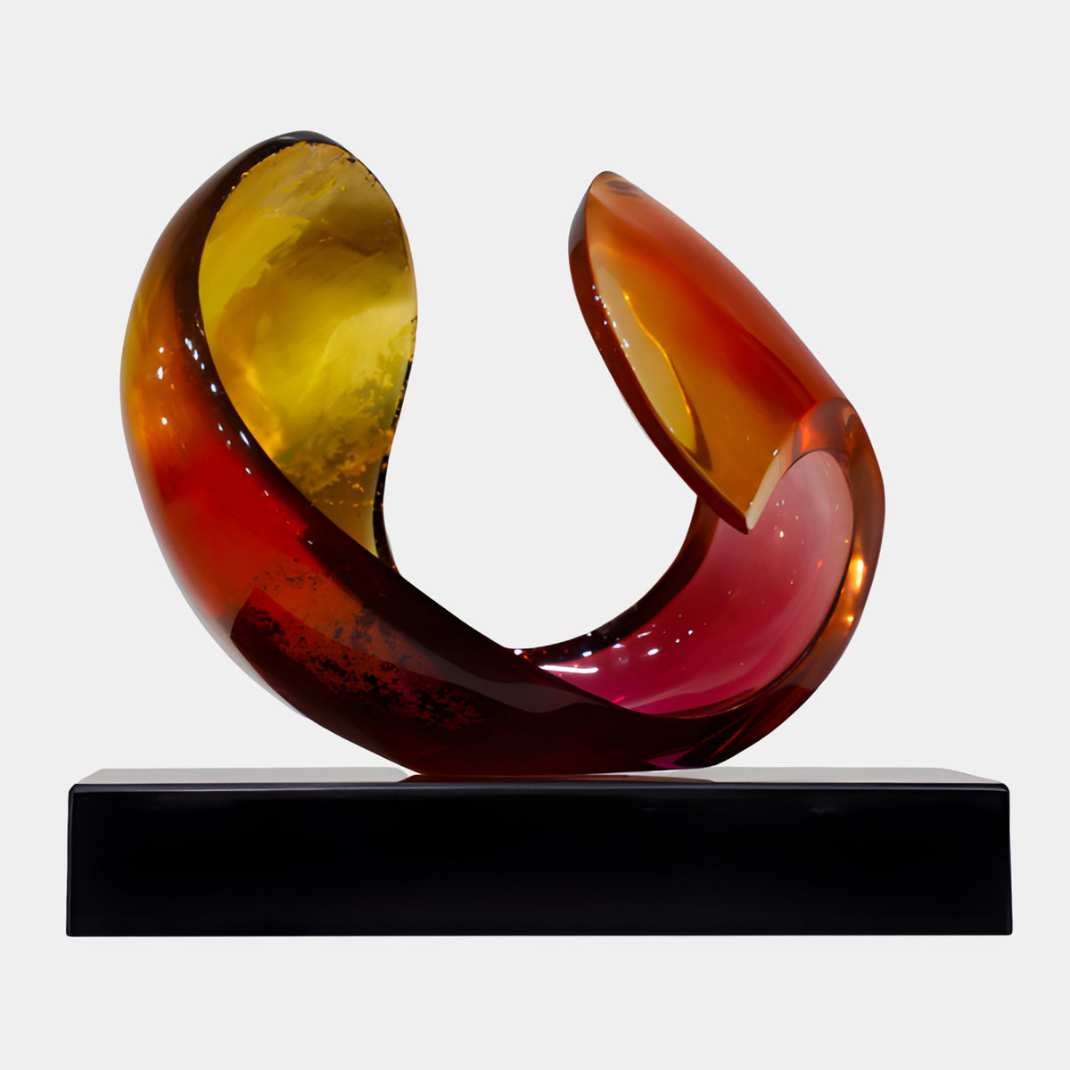Red & Yellow Hooked Twin-Lobe Resin Sculpture, 38cm, with curled lobes in red, orange, yellow and crimson tones, on a black rectangular base, plain white background.