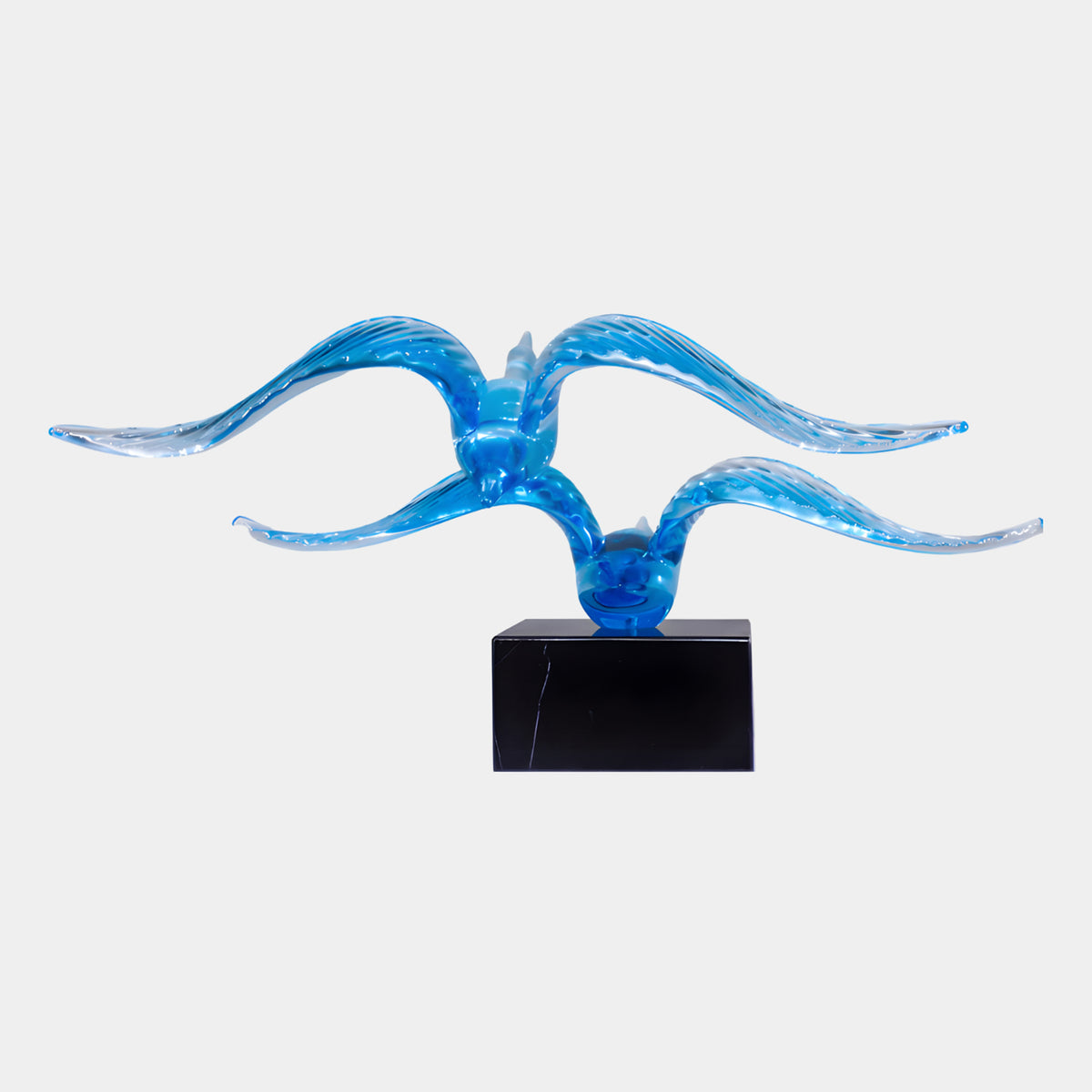 Blue Diving Twin Bird Resin Sculpture - 45cm, two blue resin birds with ribbed sweeping wings on a black marble base, set against a plain white background.