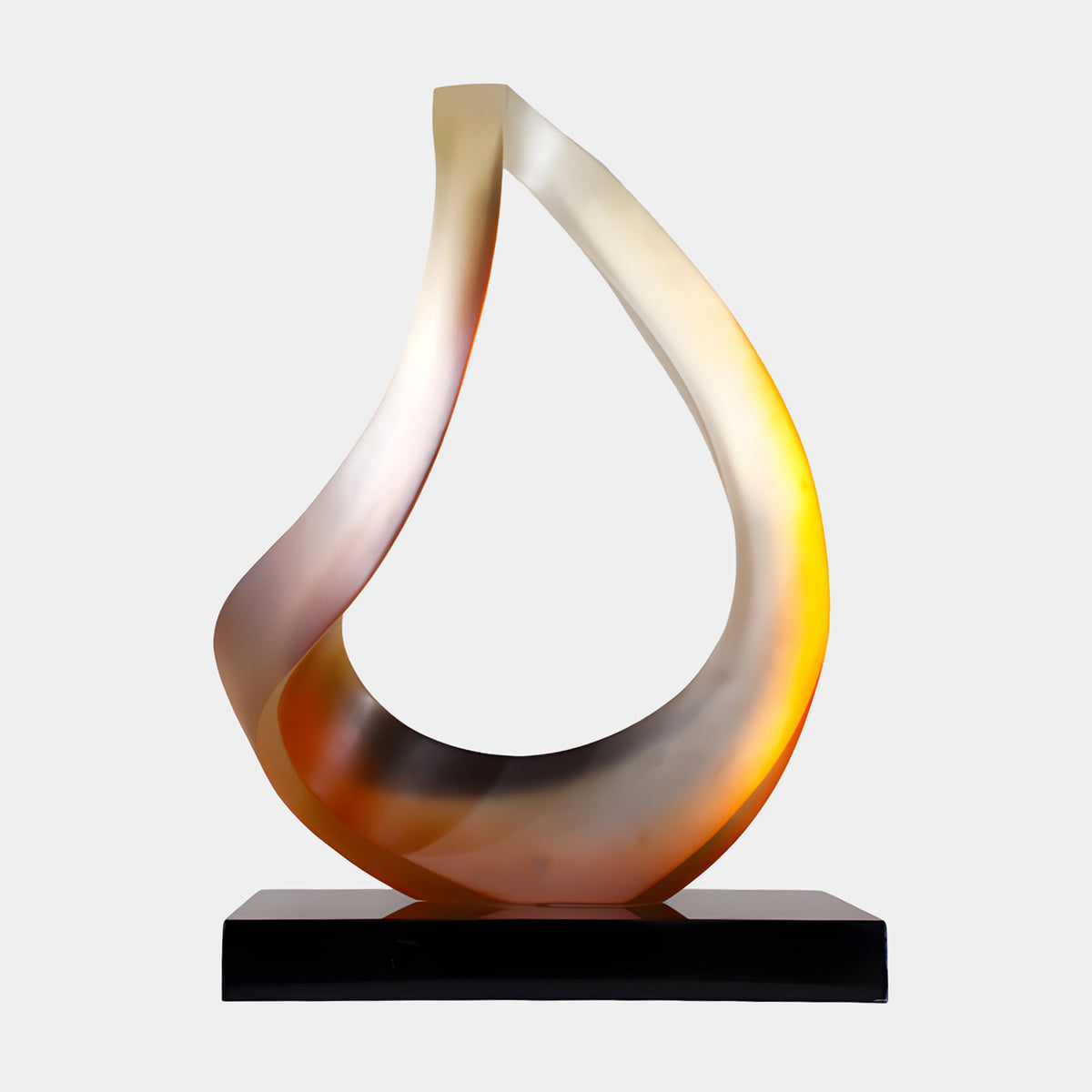 Orange & Cream Teardrop Loop Resin Sculpture, 75cm, frosted ribbon form on black base, amber and dusky rose tones, plain white background.